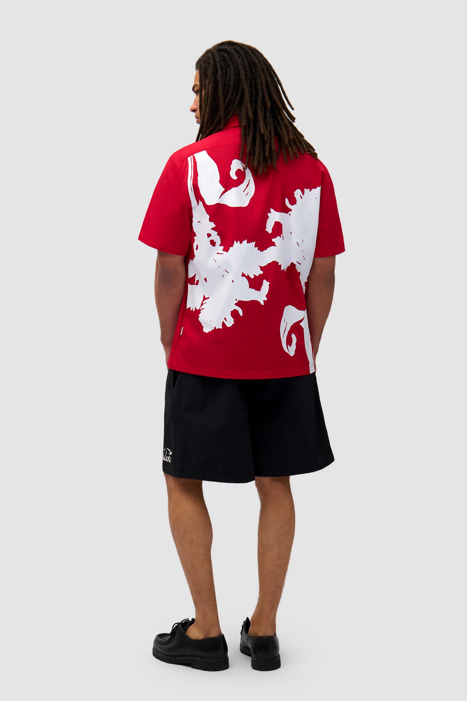 Big Flower Shirt in Red/White worn by a model, full-body back view