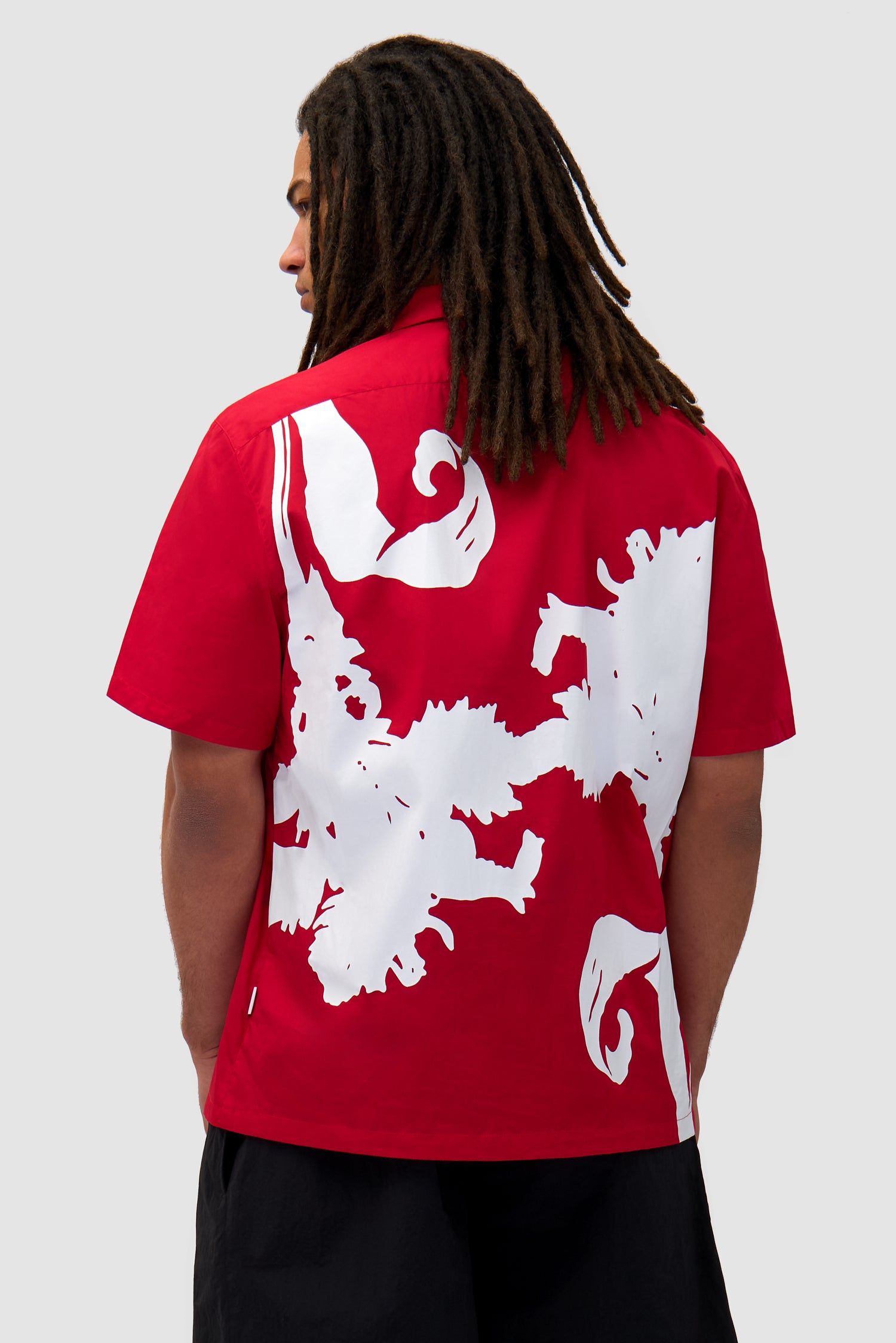 Big Flower Shirt in Red/White worn by a model, half-body back view