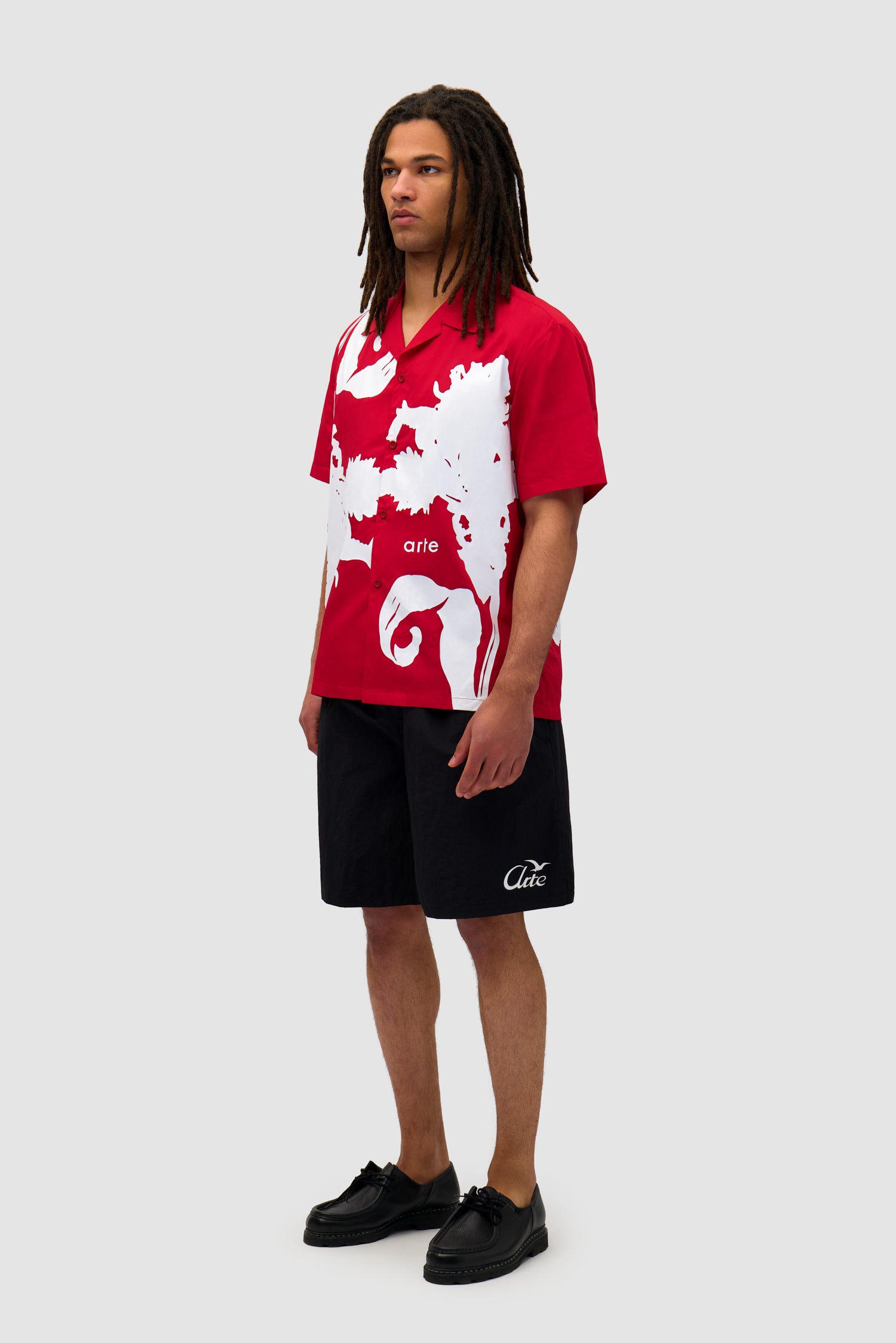 Big Flower Shirt in Red/White worn by a model, full-body side view