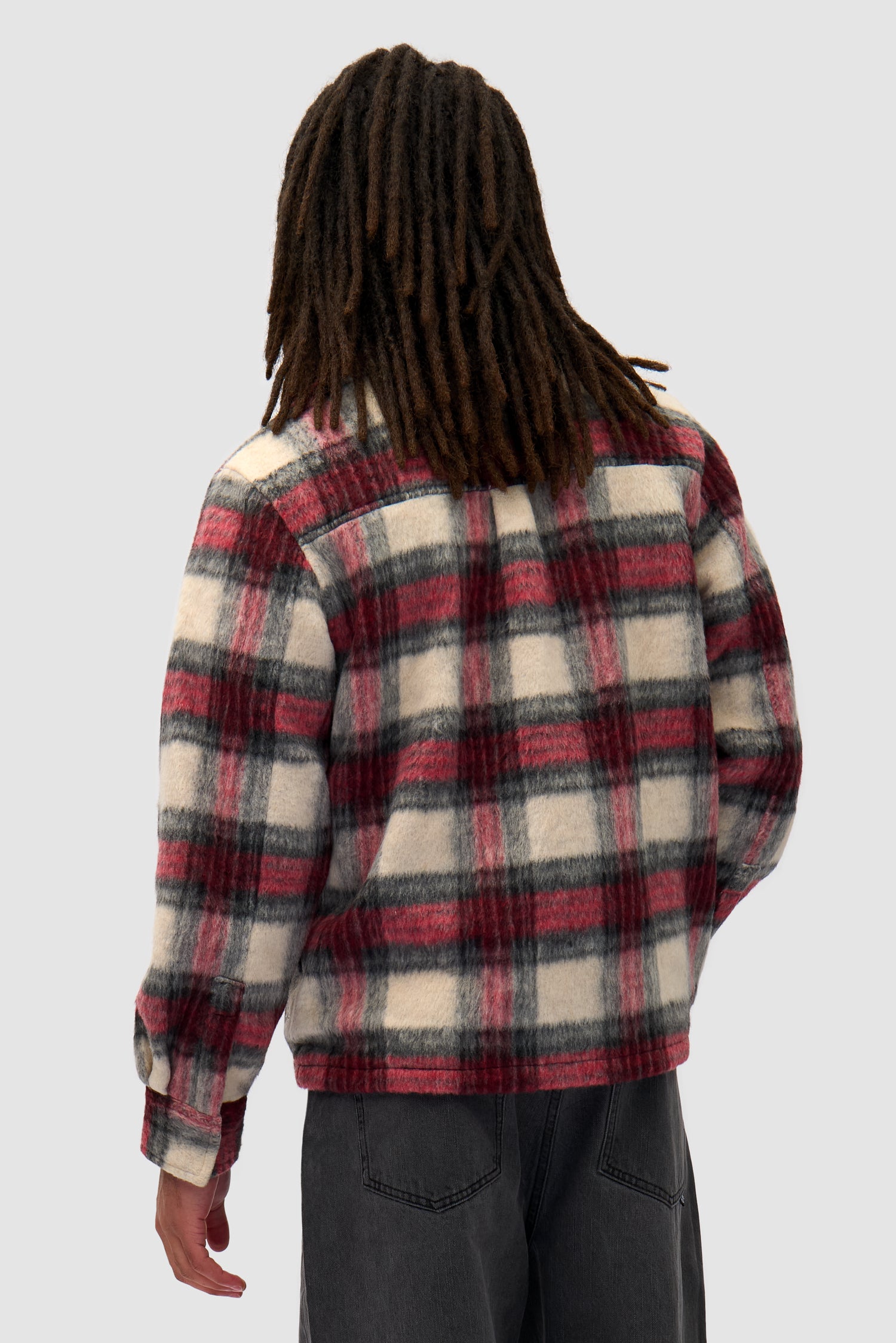 Plaid Zipper Shirt in Plaid worn by a model, half-body back view