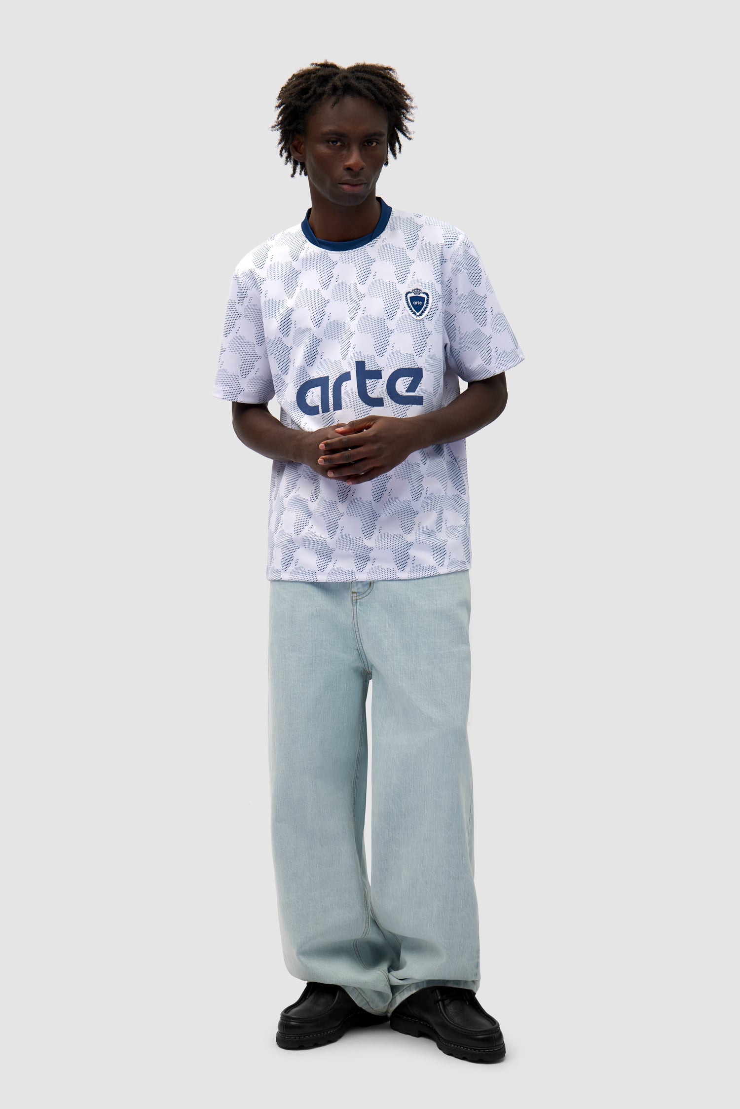 Footbal Shirt in White/Navy worn by a model, full-body front view