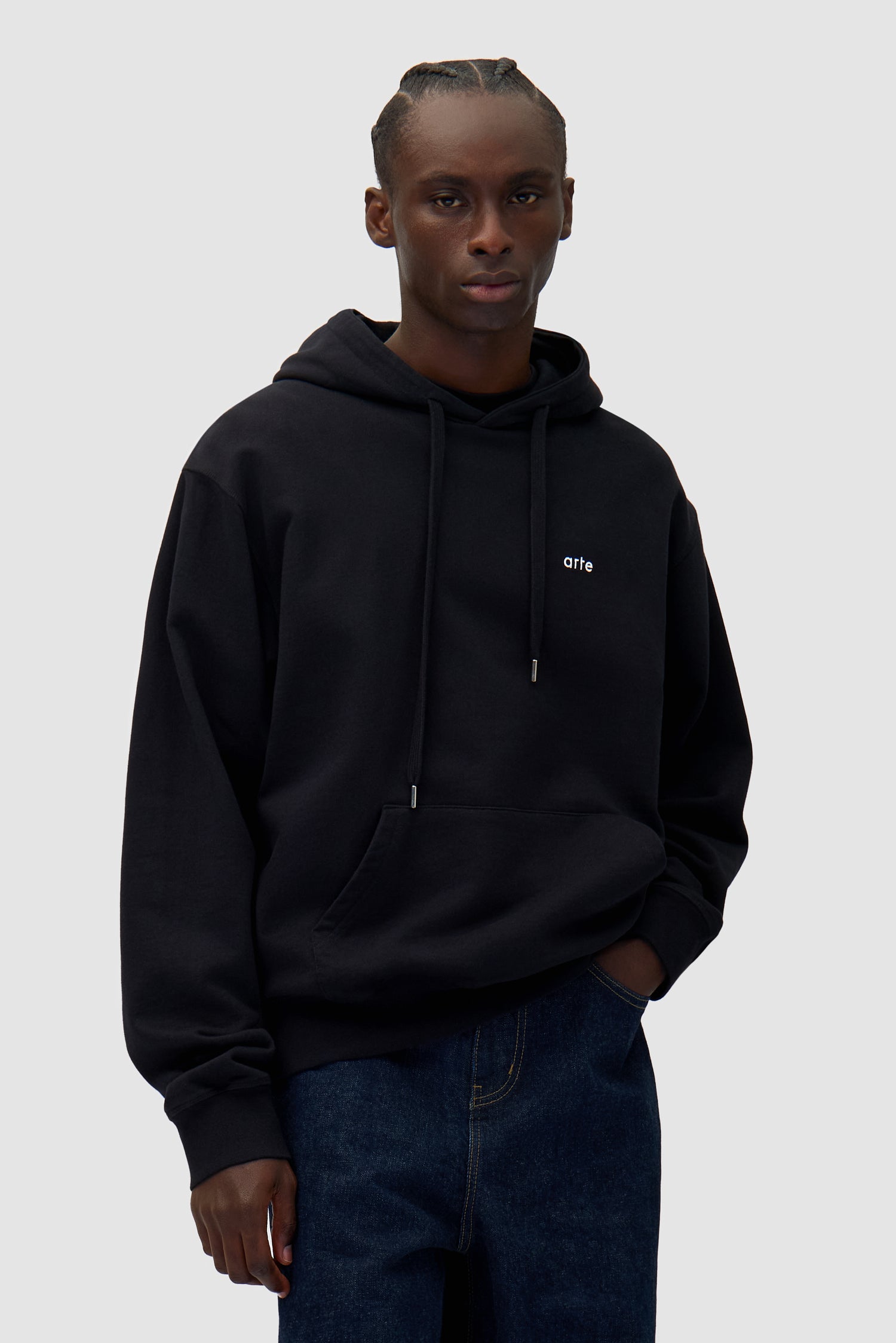 Energy Print Hoodie in Black worn by a model, half-body back view