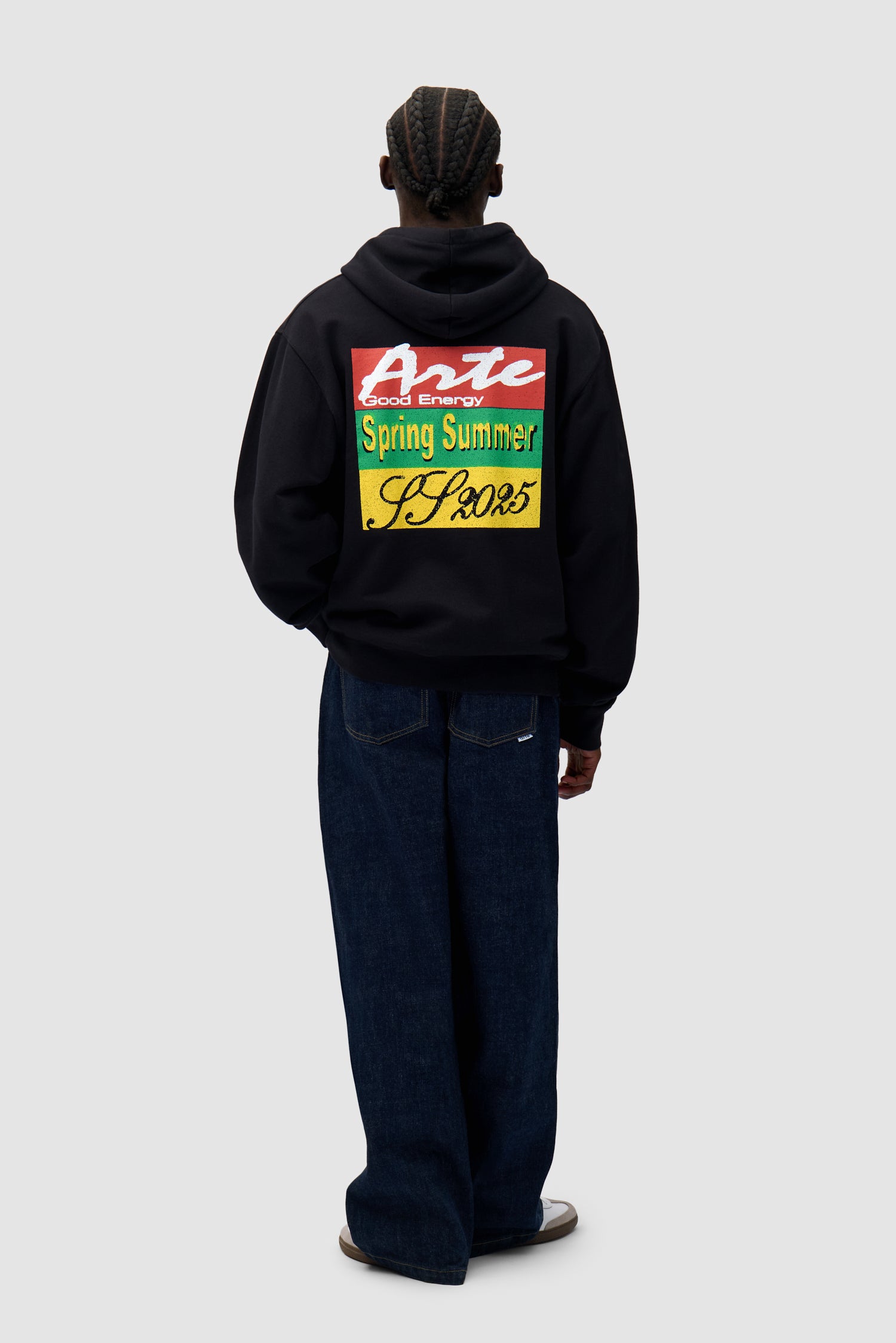 Energy Print Hoodie in Black worn by a model, full-body side view