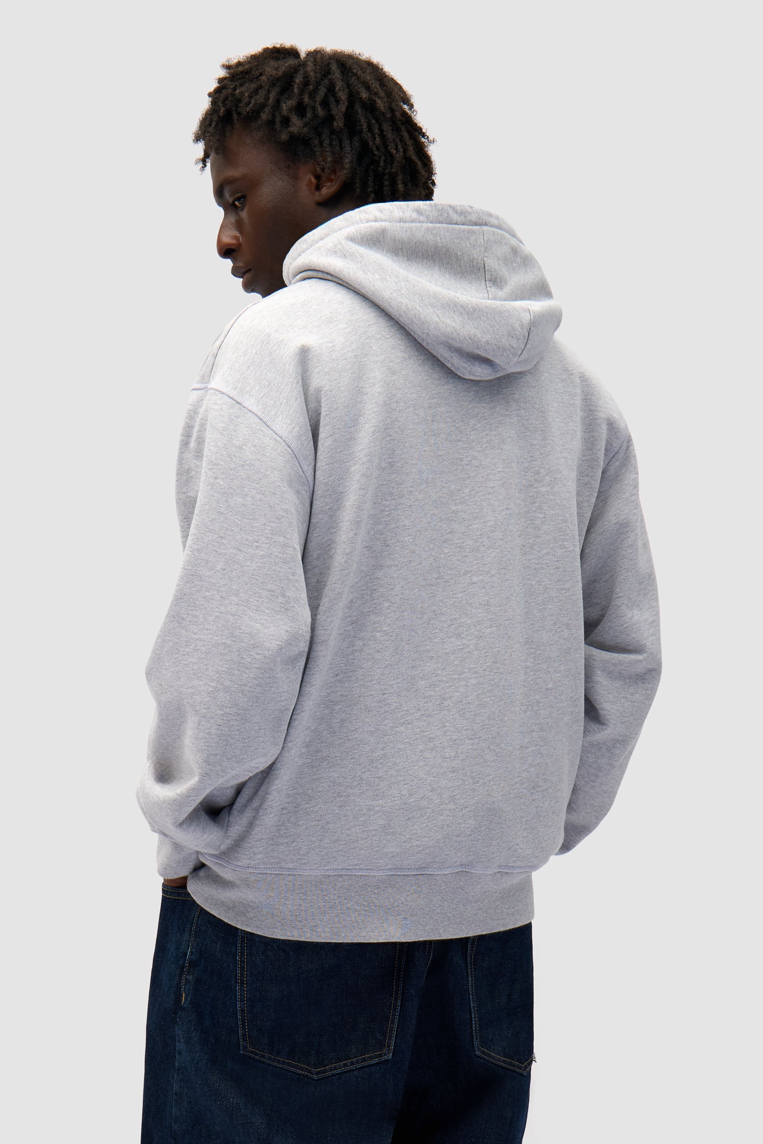 Big Bird Hoodie in Grey worn by a model, half-body back view