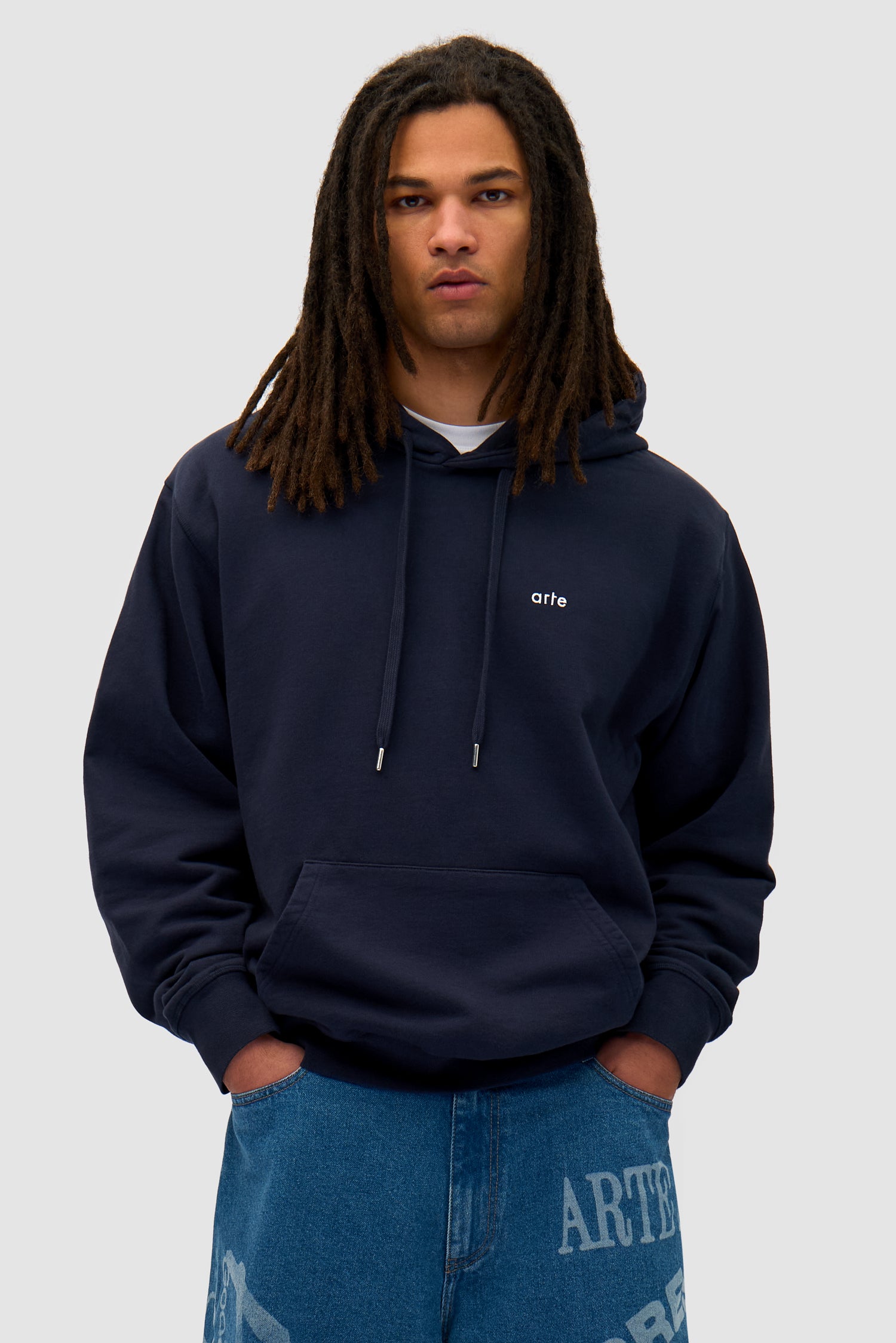 Back Sun & Moon Hoodie in Navy worn by a model, half-body back view