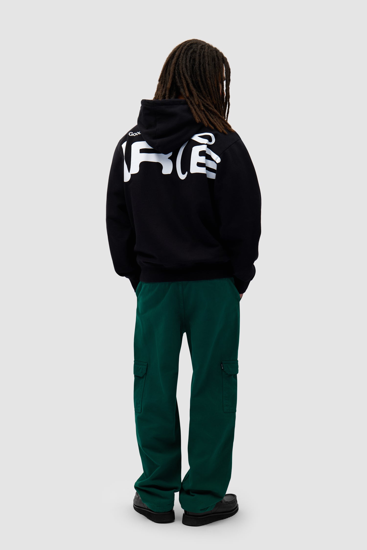 Energy Hoodie in Black worn by a model, full-body front view