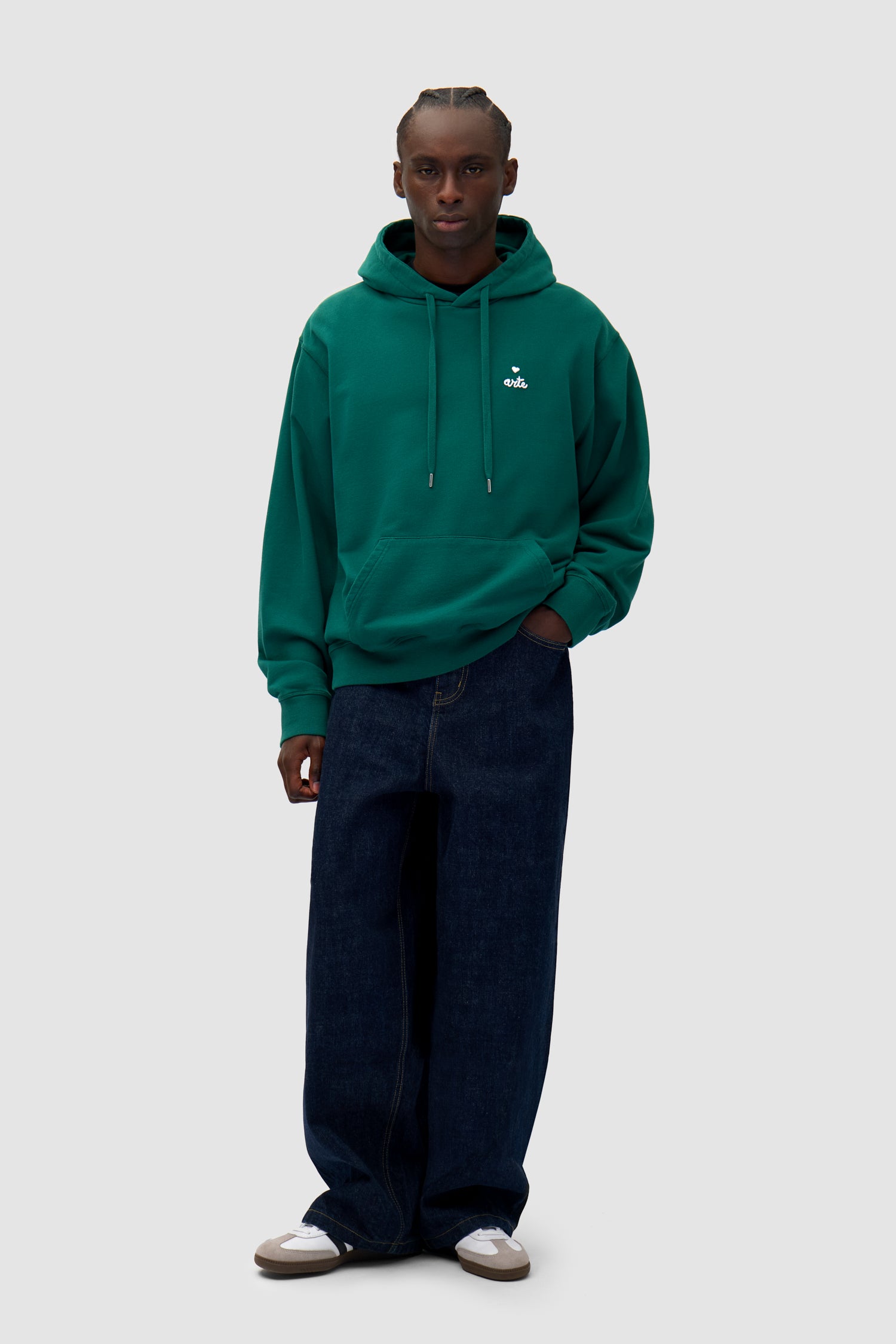 Heart Logo Hoodie in Green worn by a model, full-body front view