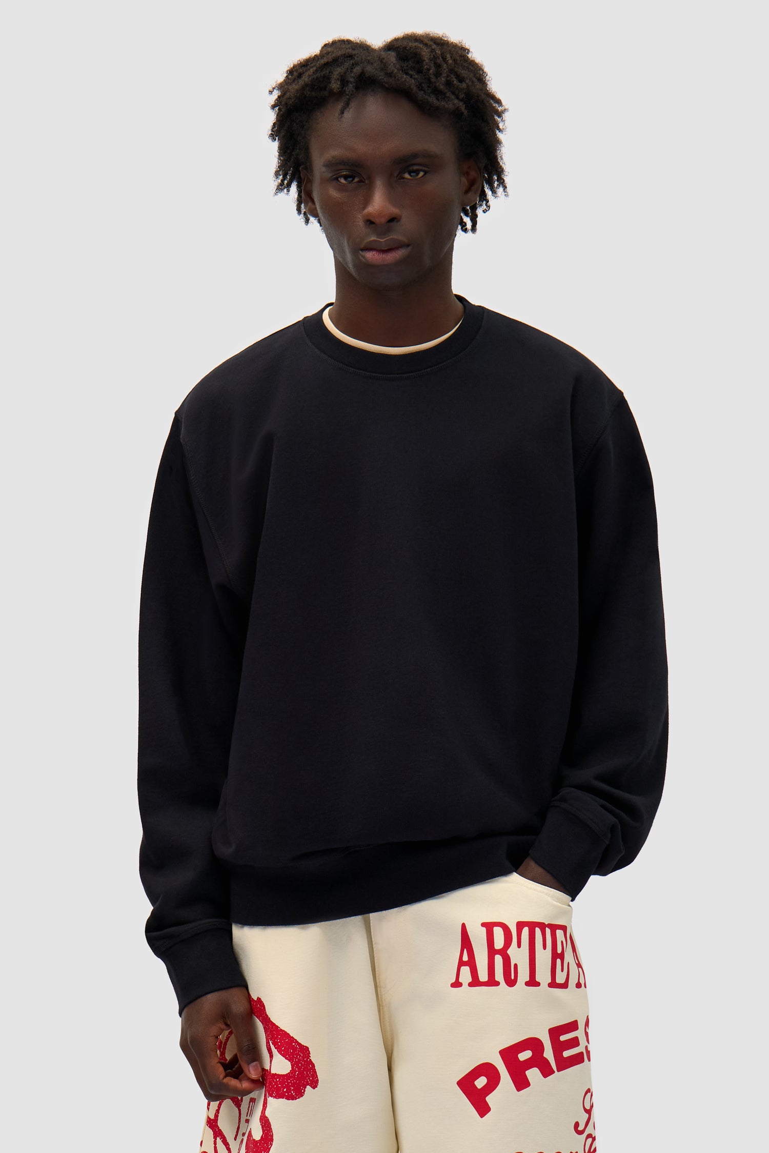 Flower Crewneck in Black worn by a model, half-body front view