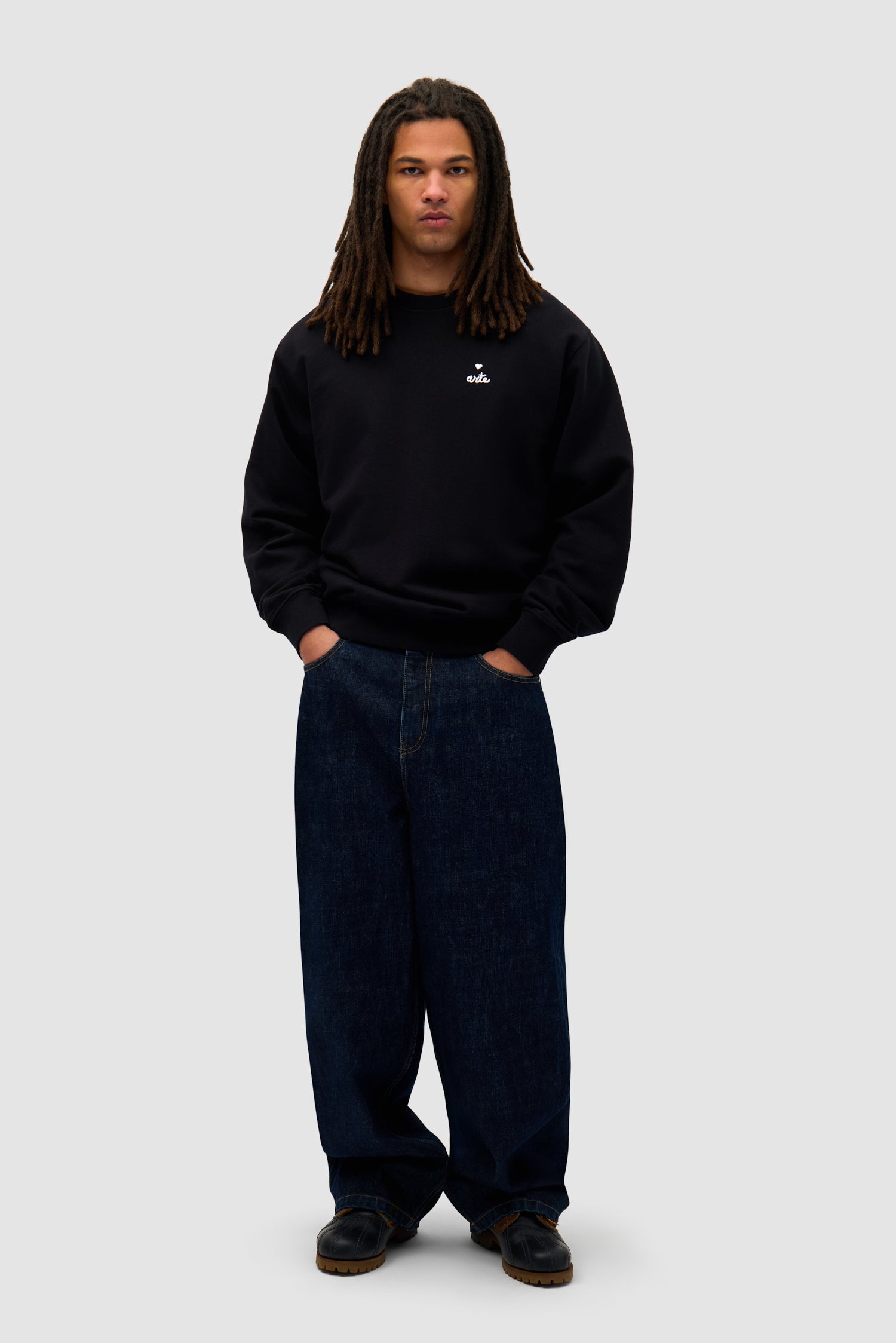 Heart Crewneck in Black worn by a model, full-body front view