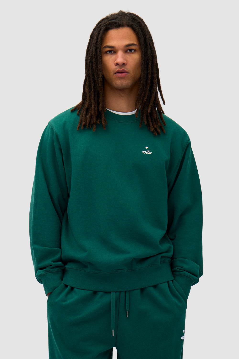 Heart Crewneck in Green worn by a model, half-body front view