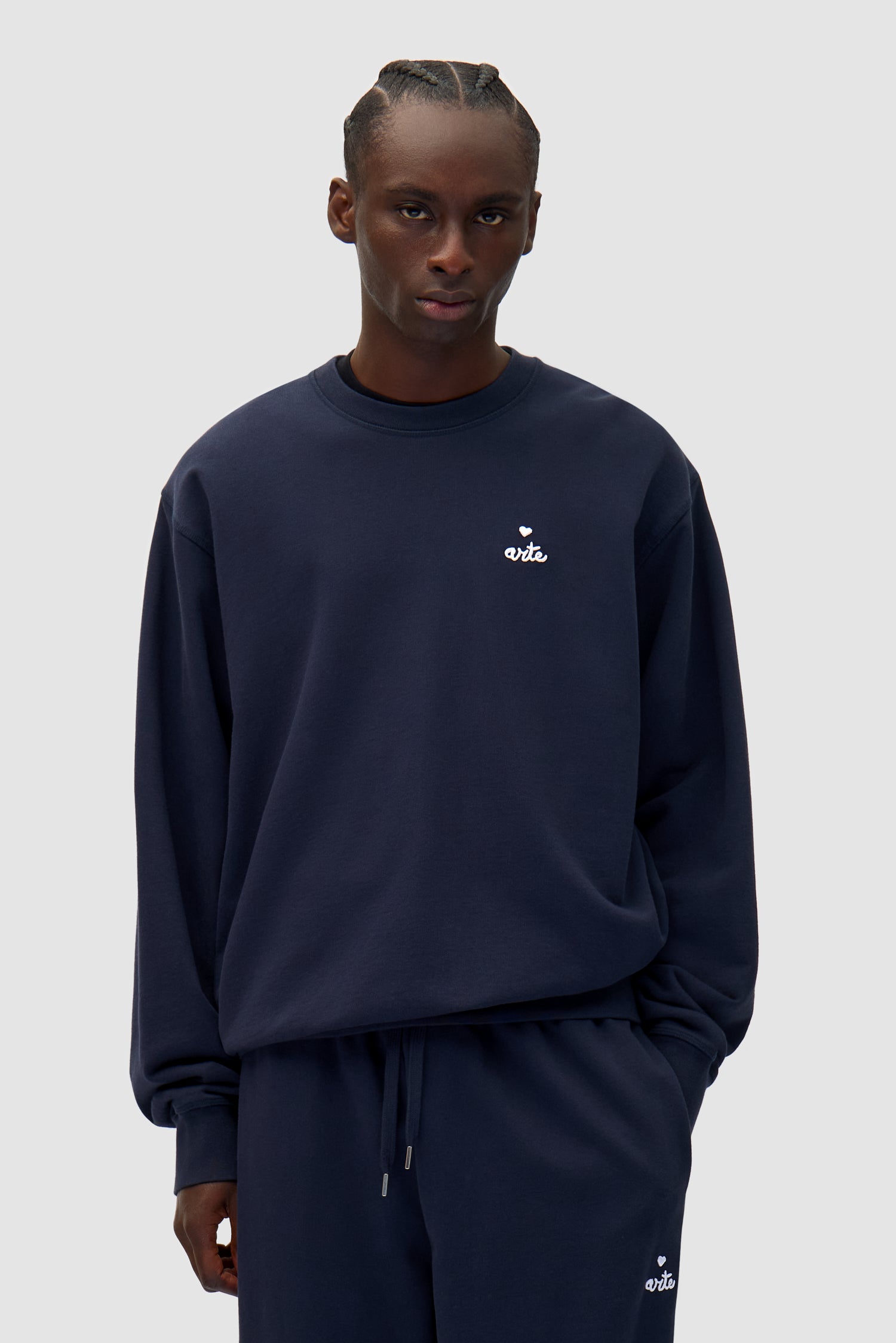 Heart Crewneck in Navy worn by a model, half-body front view