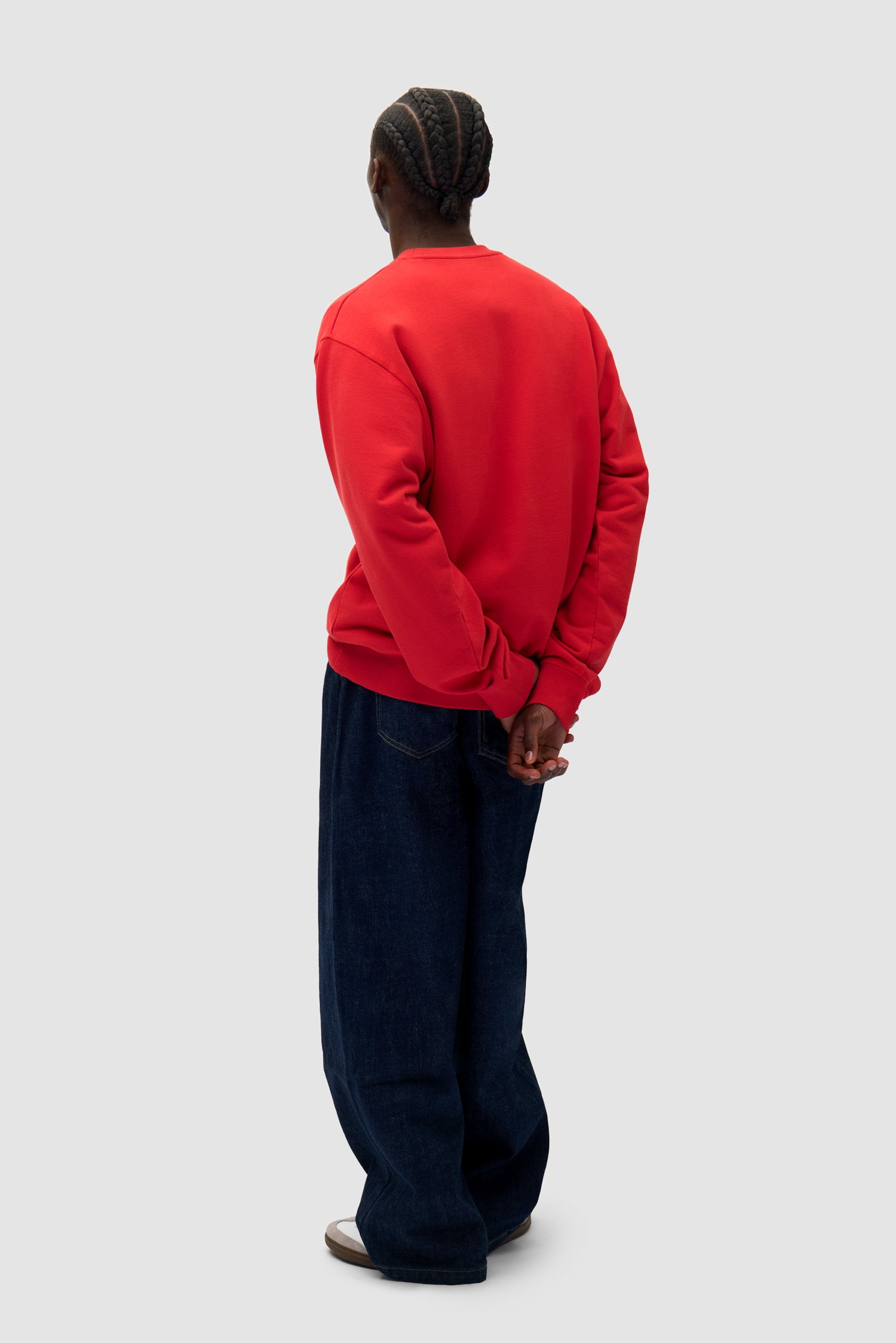Heart Crewneck in Red worn by a model, full-body side view