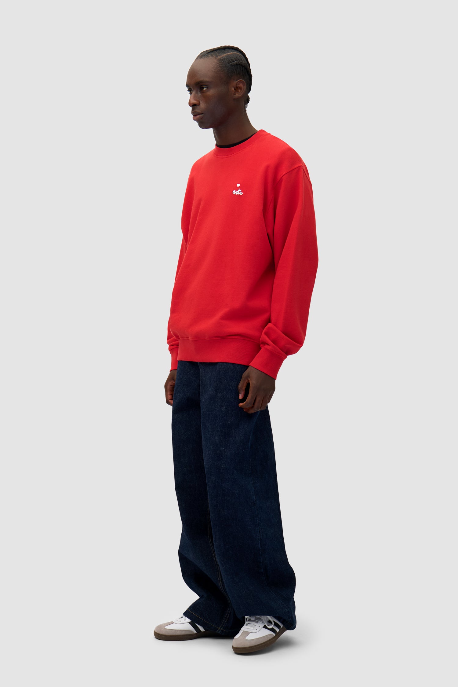 Heart Crewneck in Red worn by a model, full-body back view