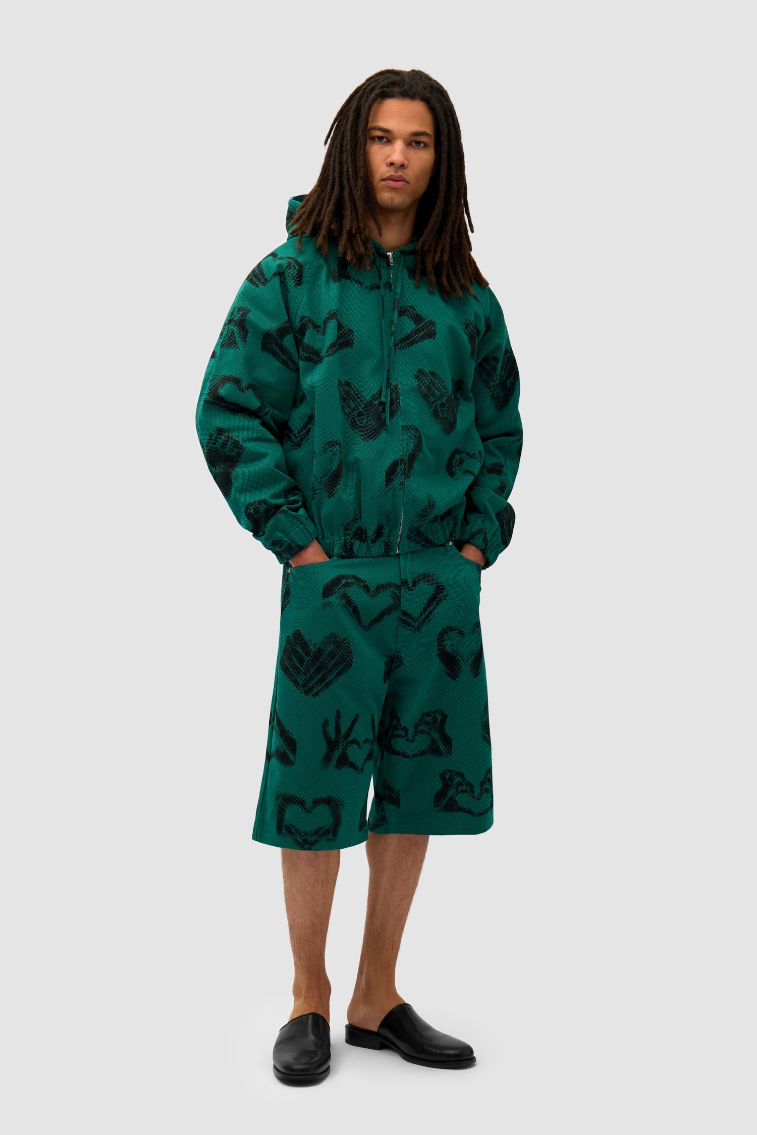 Hands Print Jacket in Green worn by a model, full-body side view