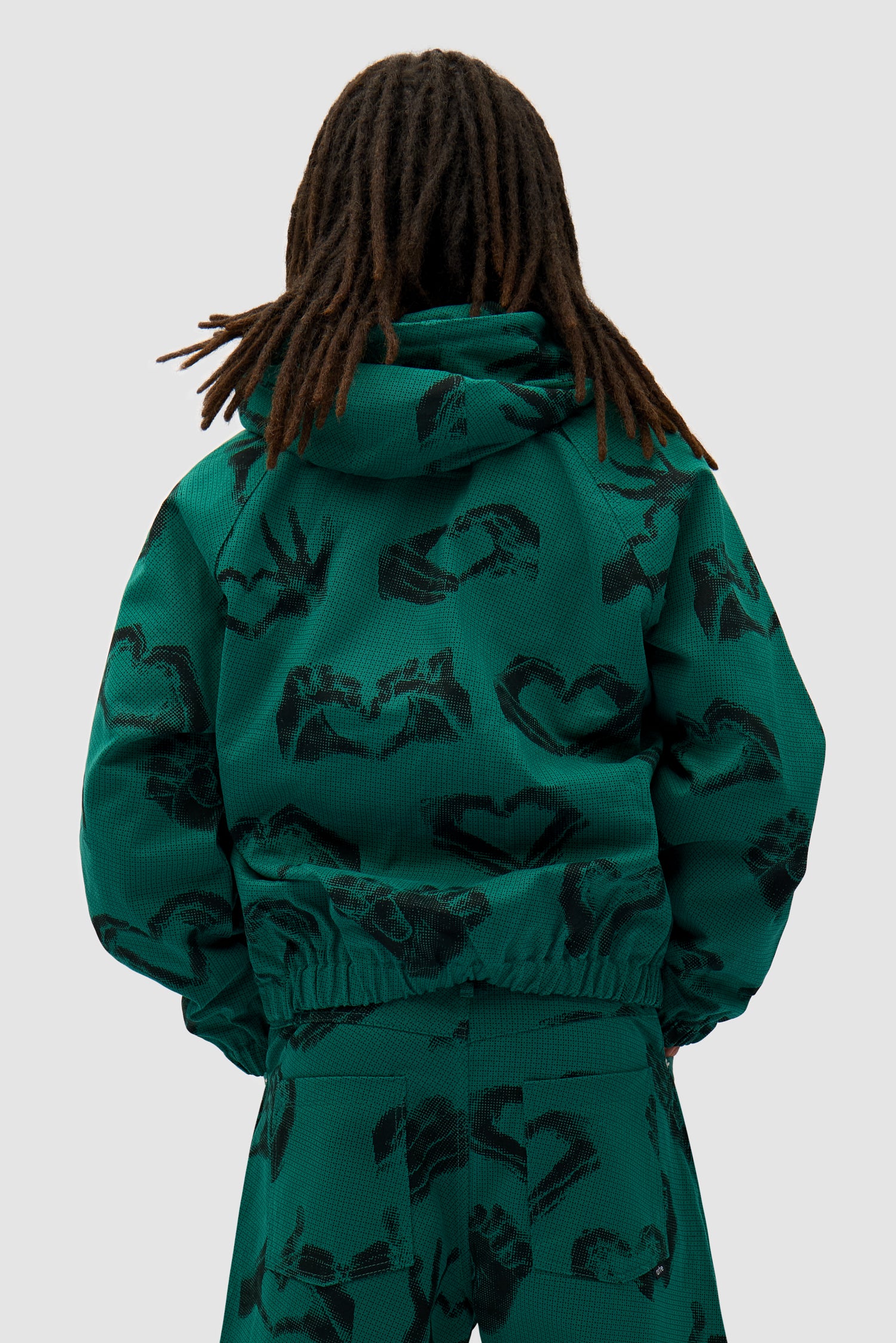 Hands Print Jacket in Green worn by a model, full-body front view