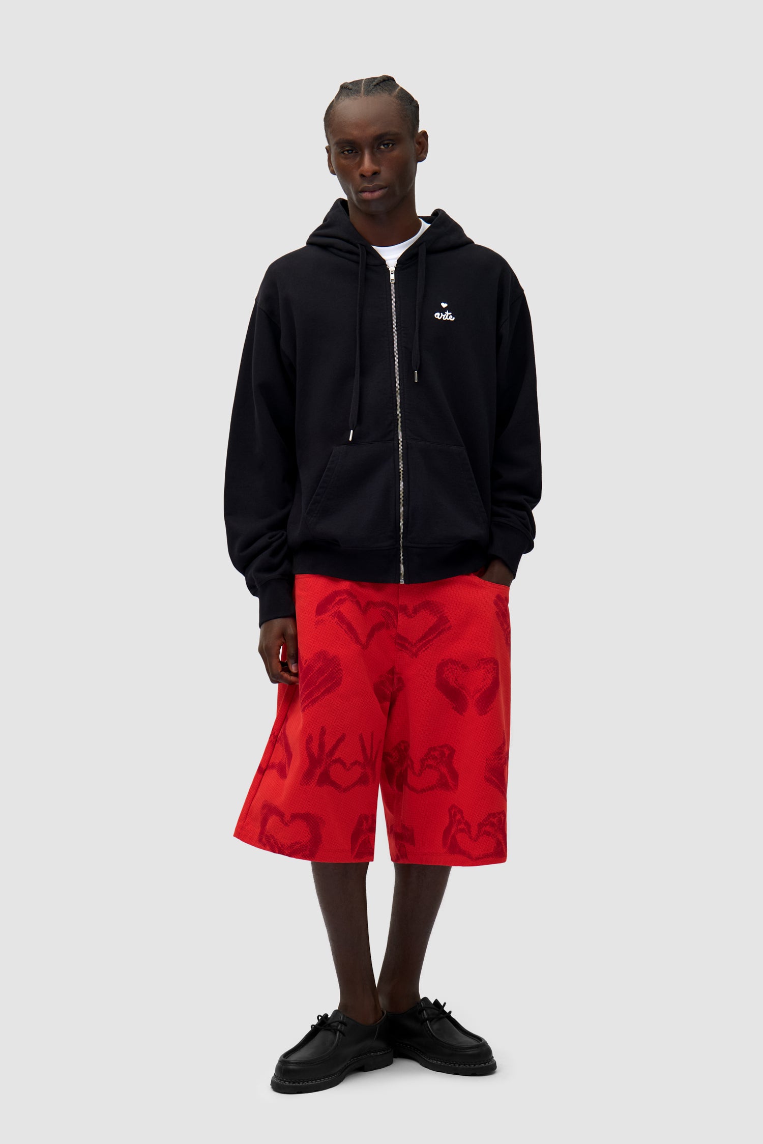 Heart Zip Hoodie in Black worn by a model, full-body front view