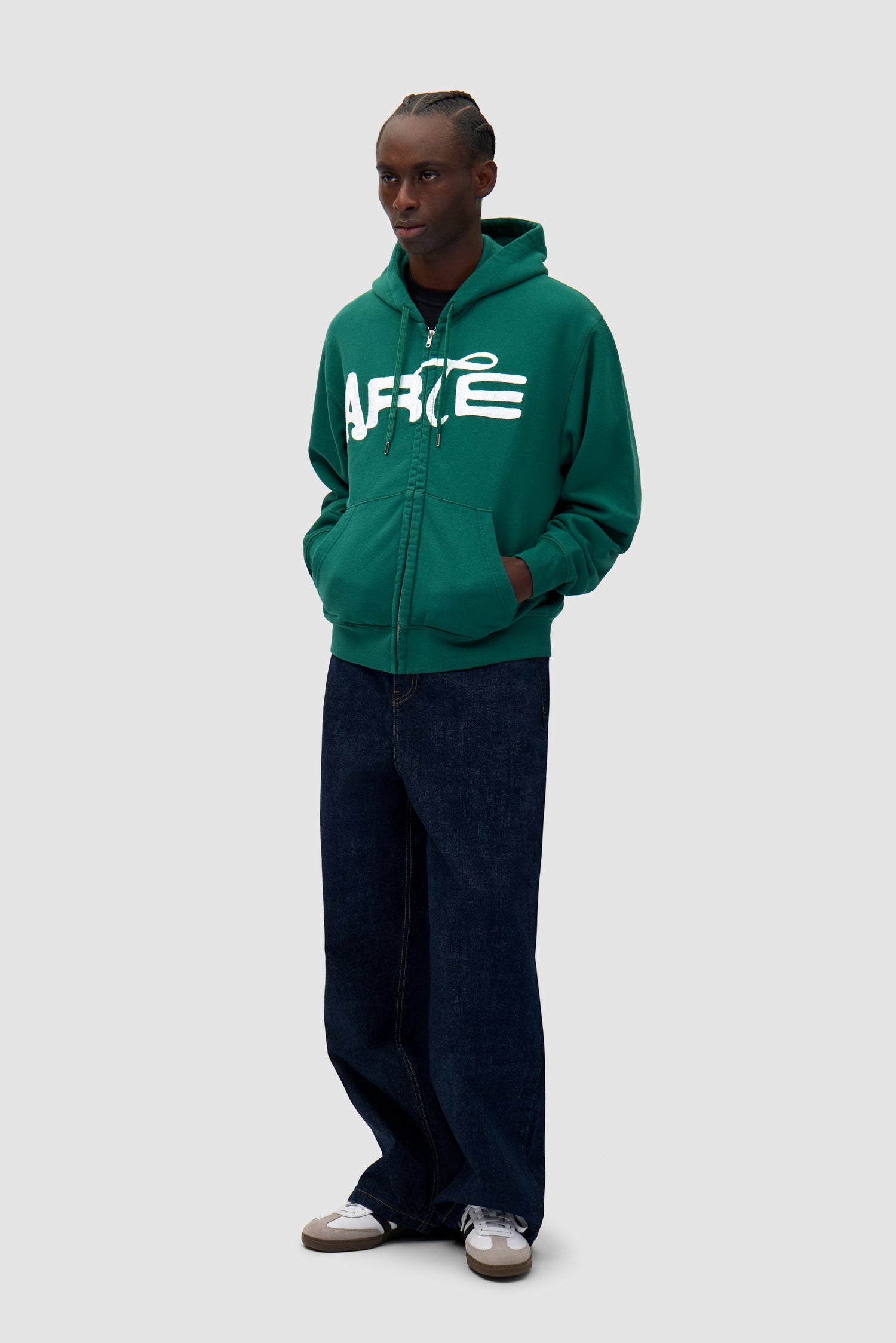 Energy Zip Hoodie in Green worn by a model, full-body side view