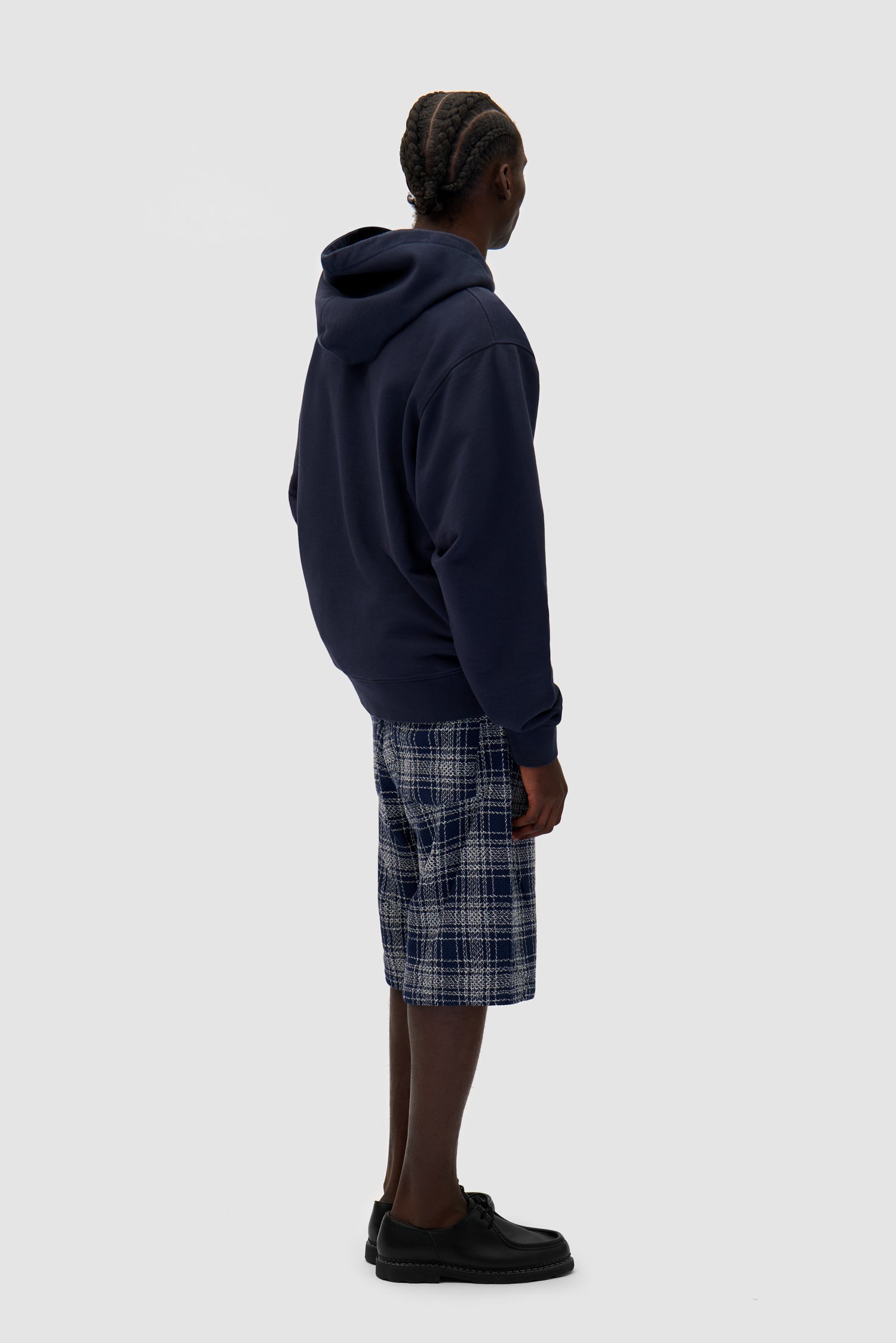 Energy Zip Hoodie in Navy worn by a model, full-body back view