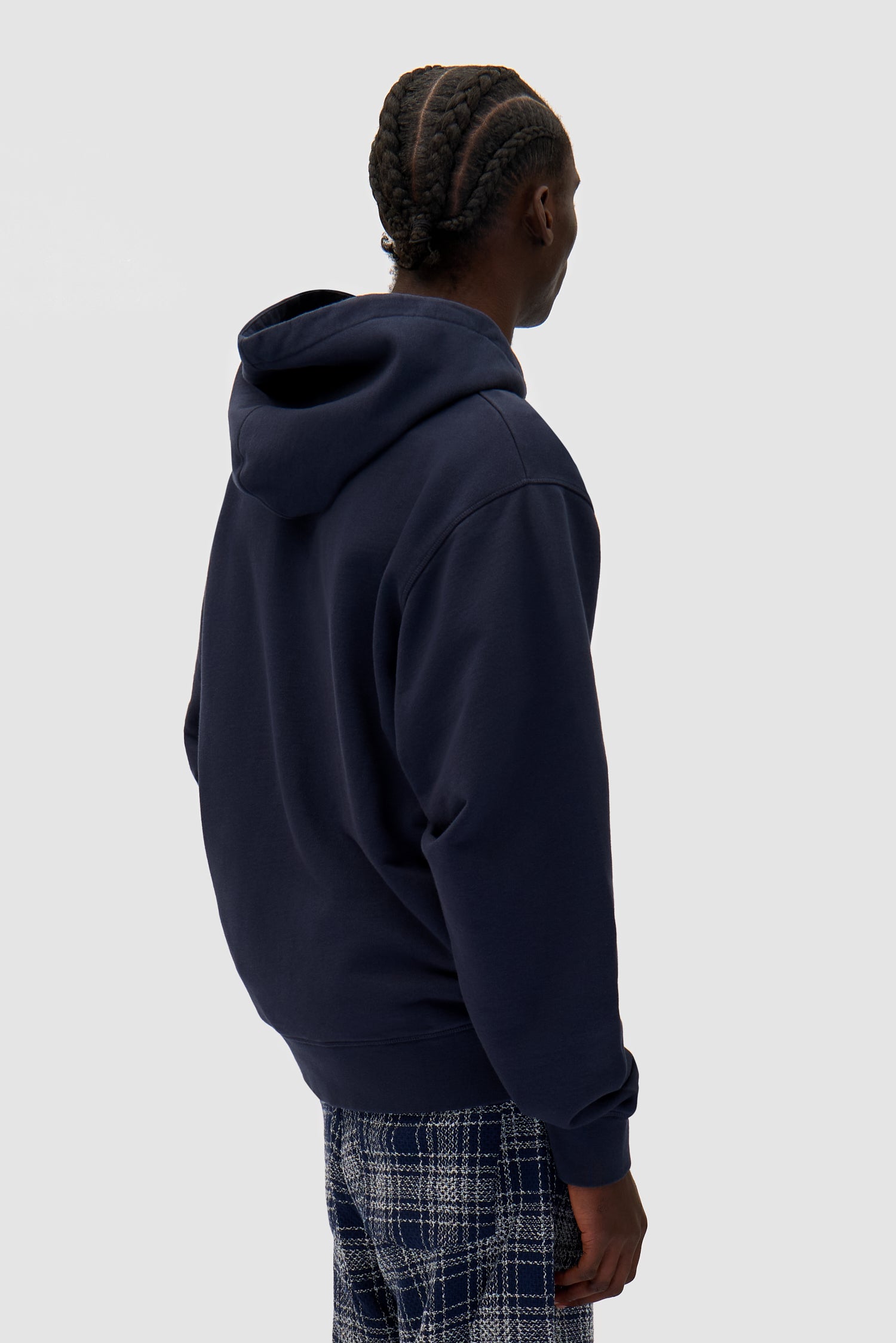Energy Zip Hoodie in Navy worn by a model, half-body back view