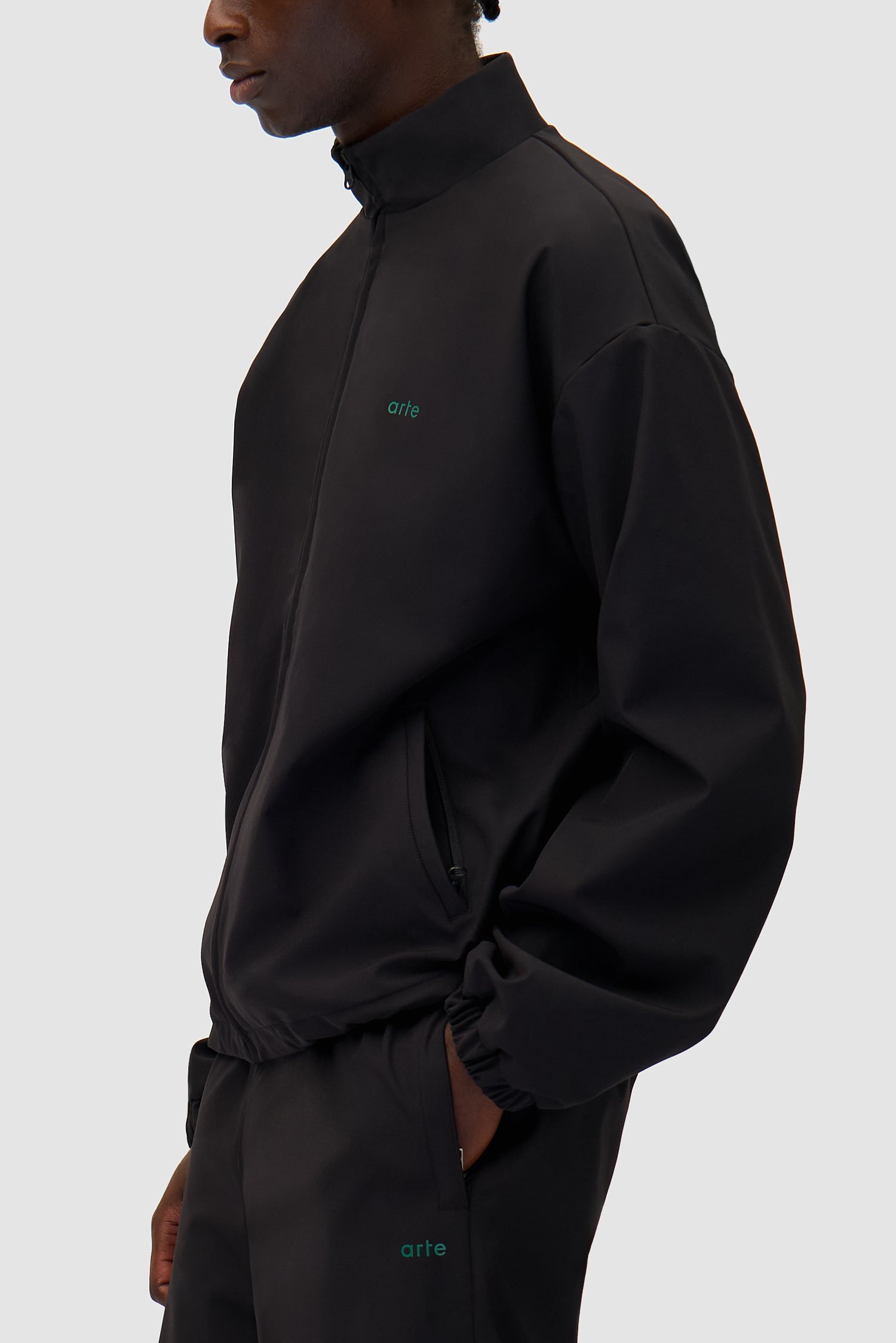 Detail view of Green Logo Jacket in Black