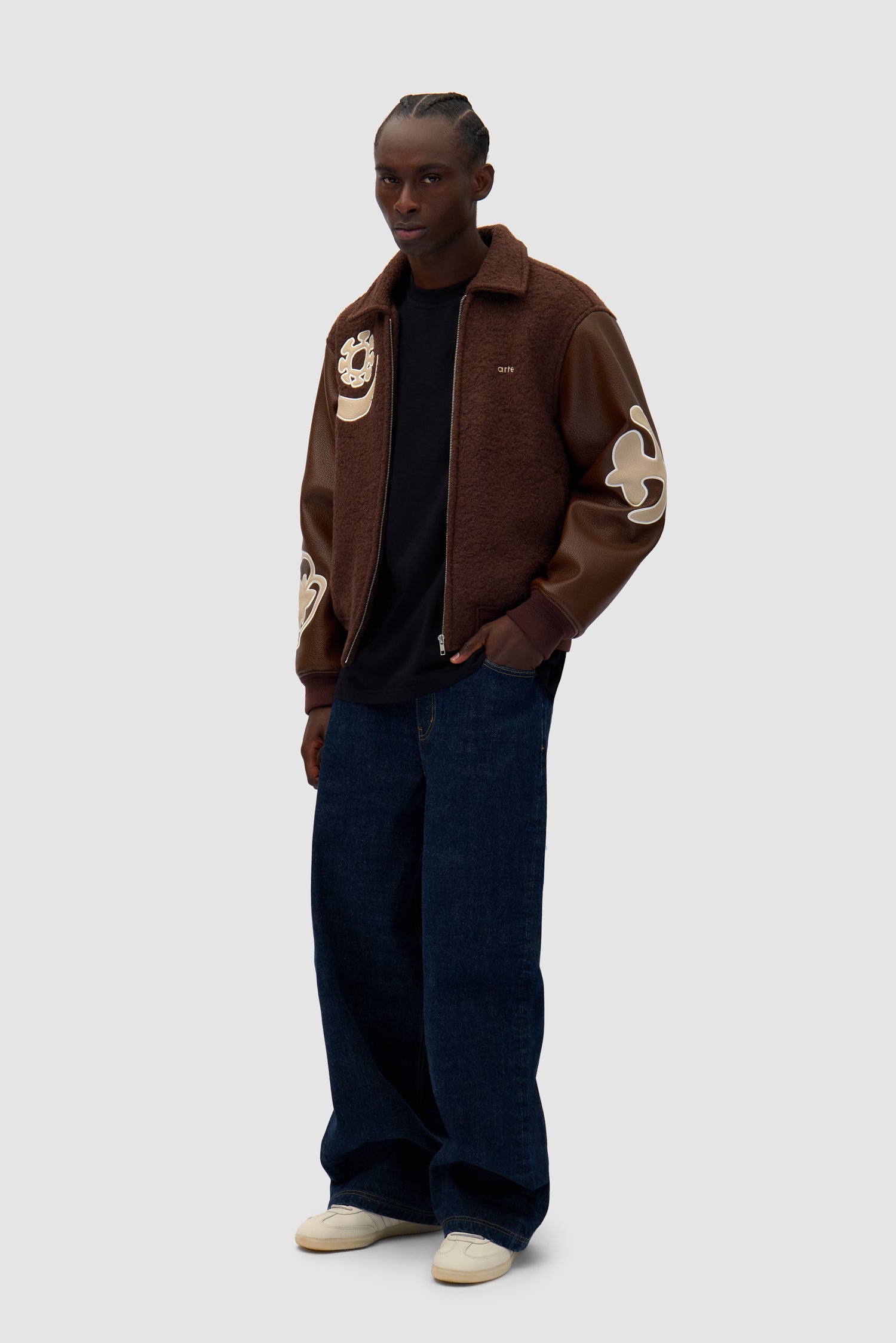 Varsity Jacket in Brown/Brown worn by a model, full-body side view