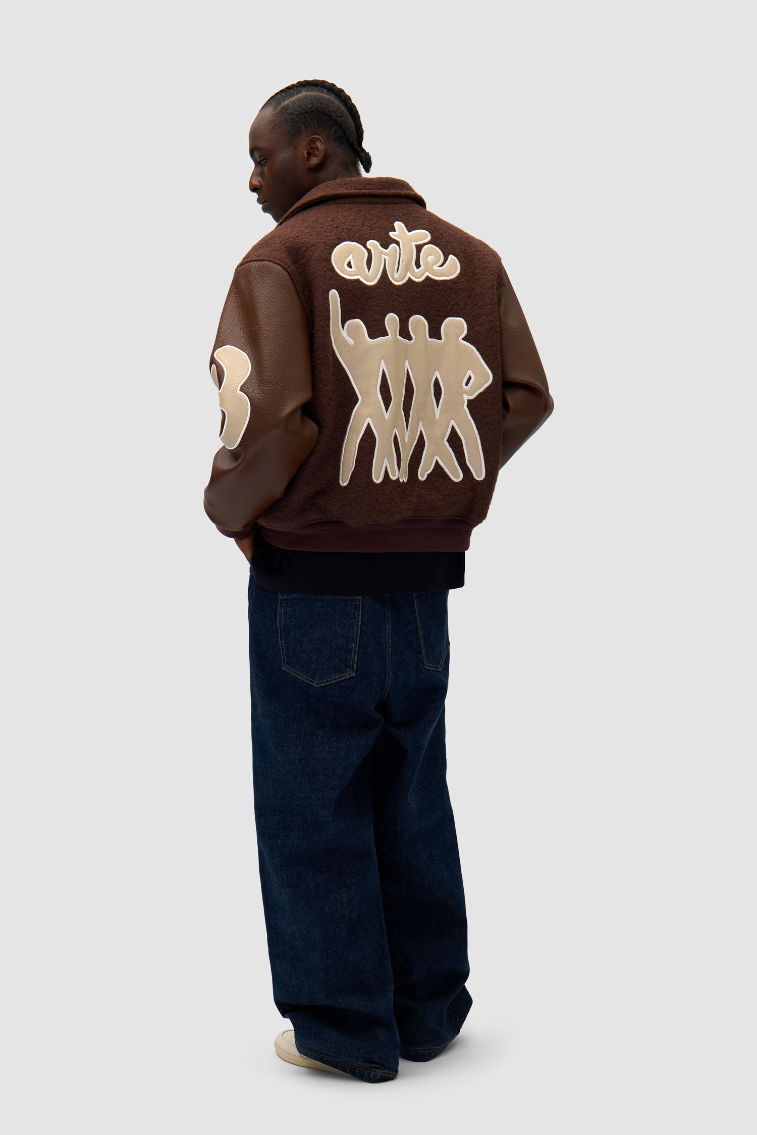 Varsity Jacket in Brown/Brown worn by a model, full-body back view