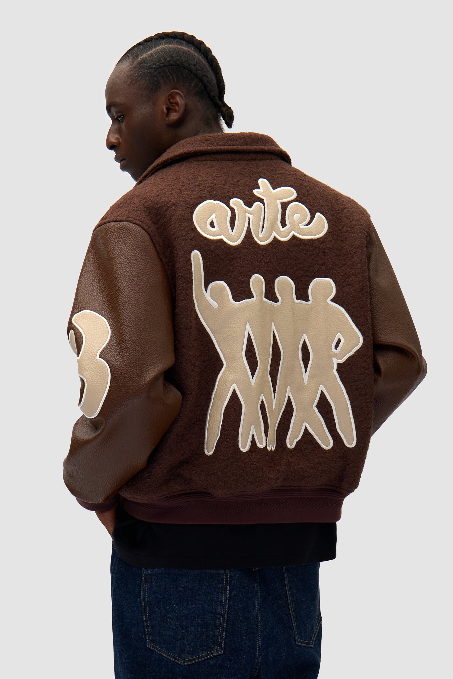 Varsity Jacket in Brown/Brown worn by a model, half-body back view