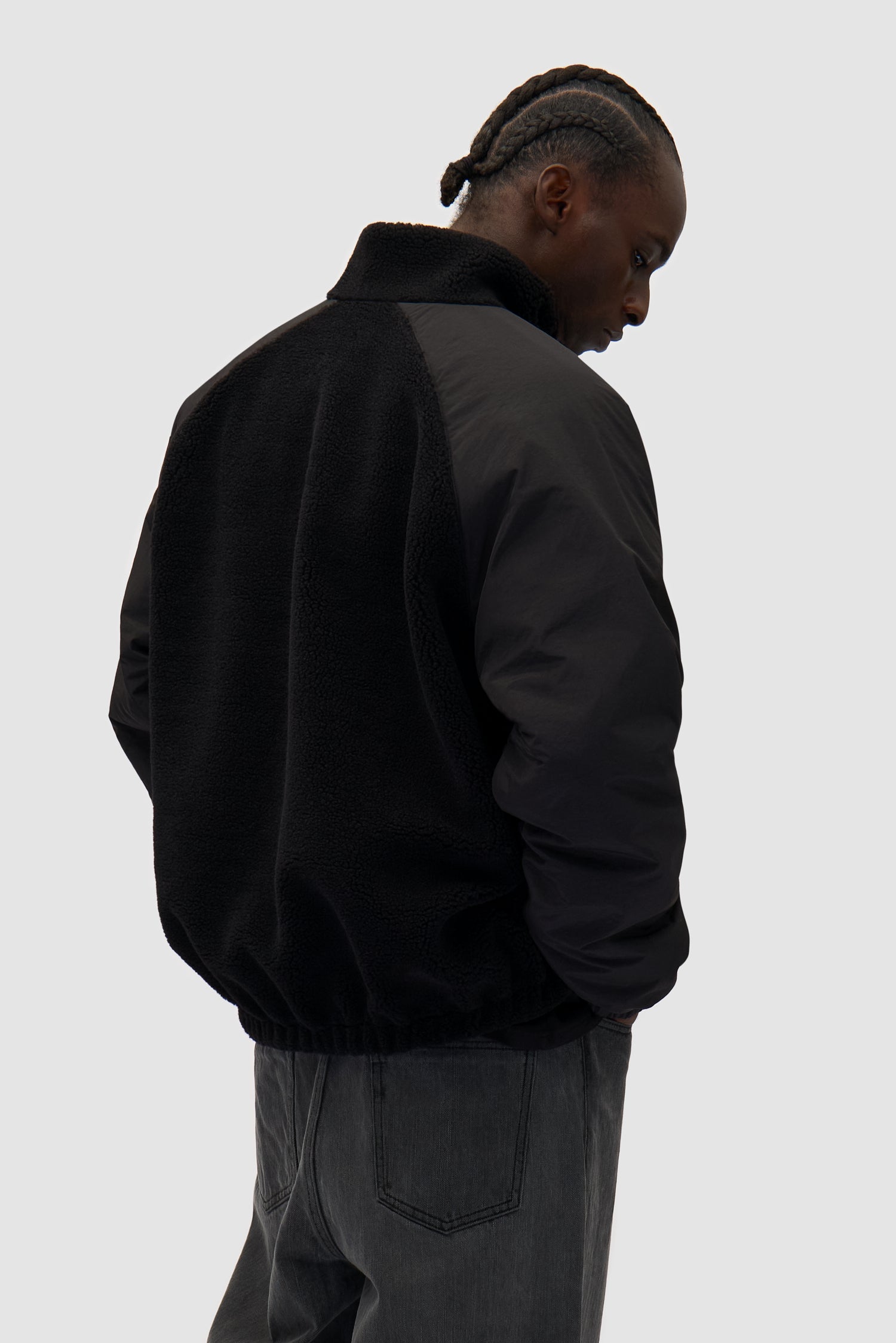 Reversible Polar Jacket in Black worn by a model, full-body front view