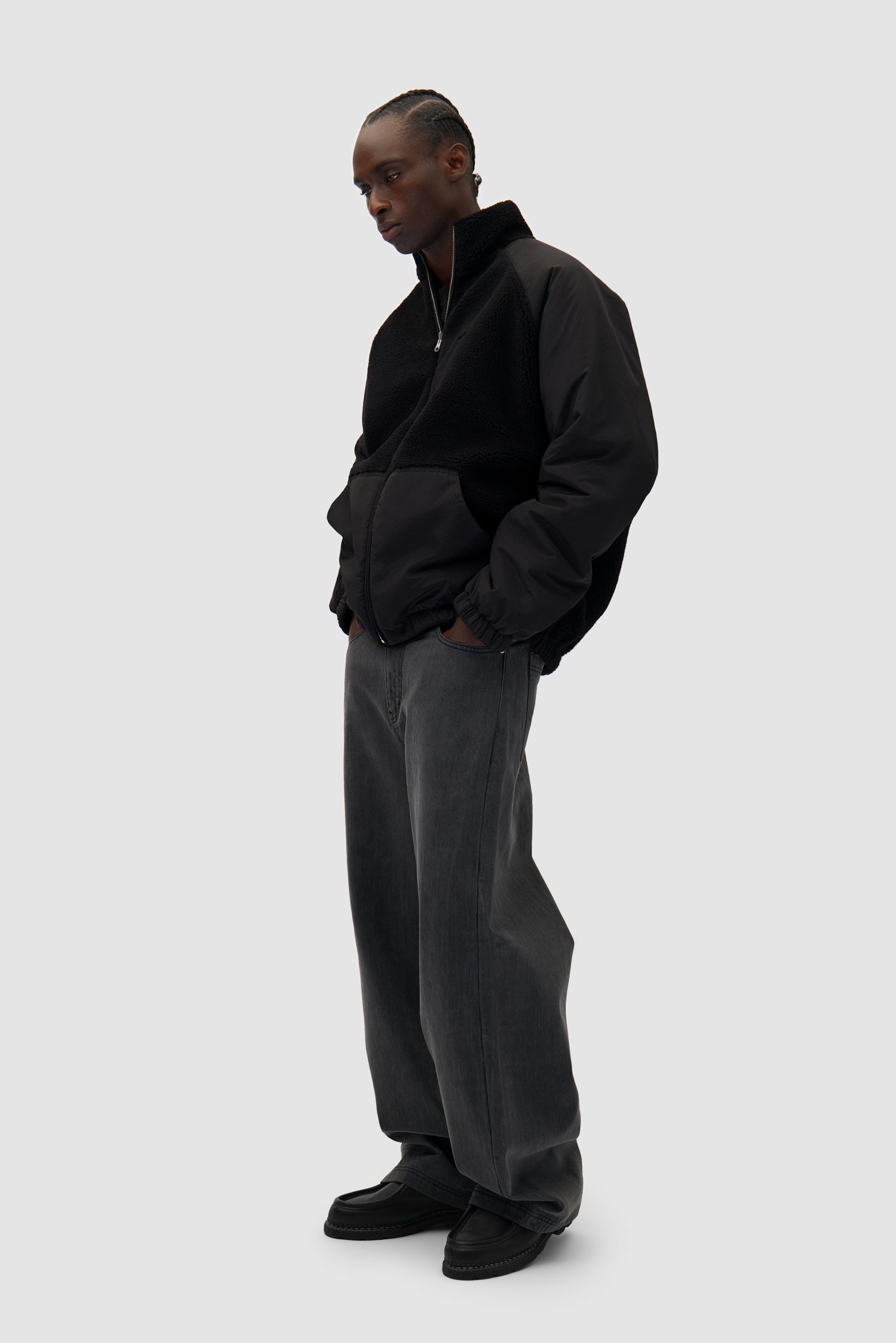 Reversible Polar Jacket in Black worn by a model, full-body back view