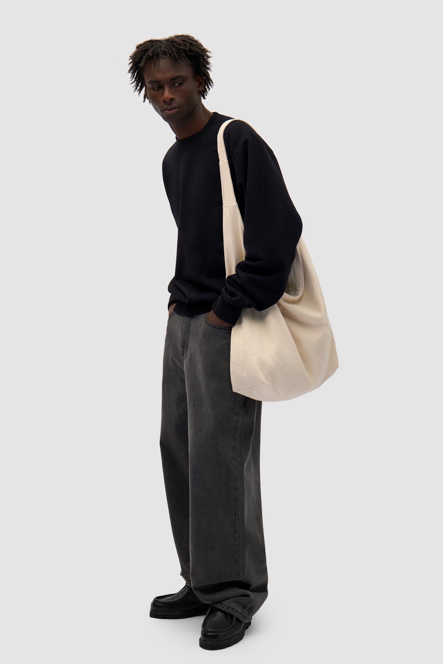 Cotton Bag in Cream worn by a model, full-body front view