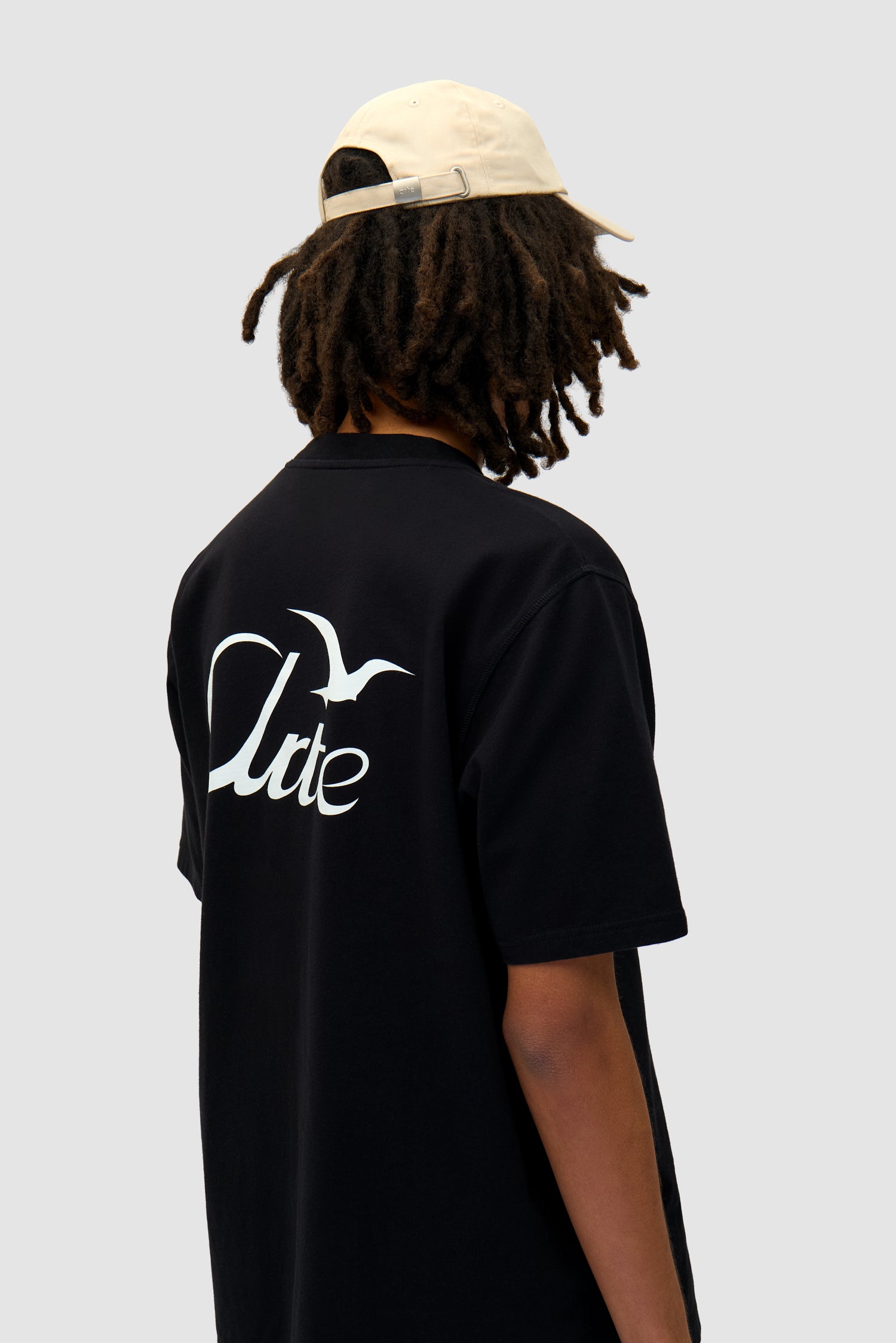 Heart Logo Cap in Cream worn by a model, full-body front view