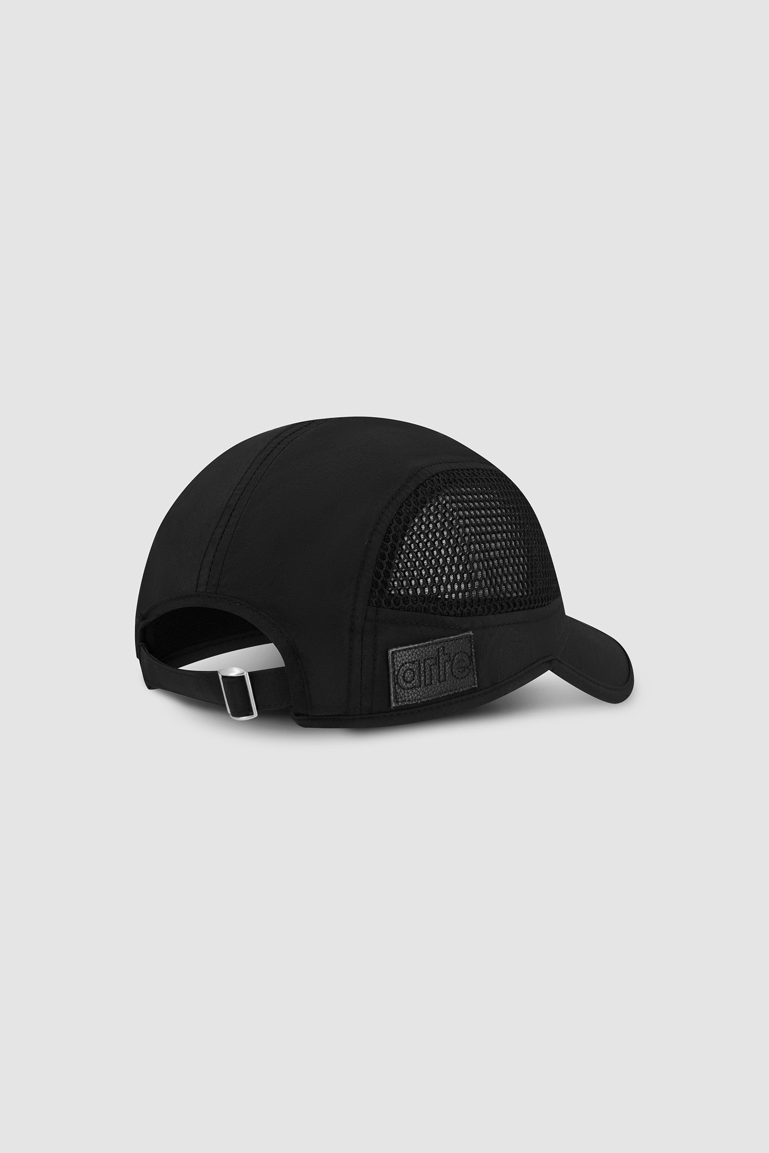 Mesh 5Panel cap in Black worn by a model, half-body front view
