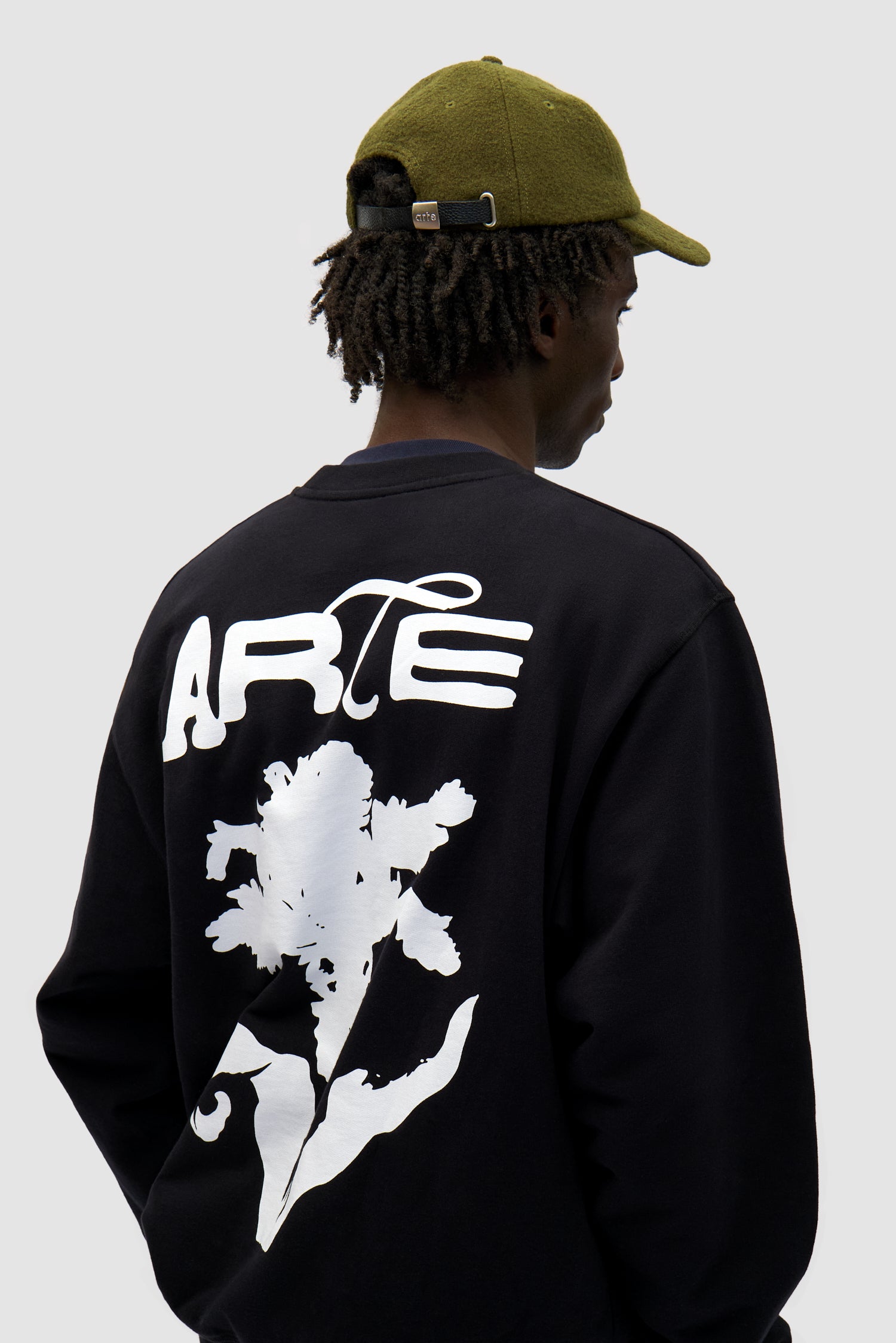 Wool Cap in Green worn by a model, full-body front view