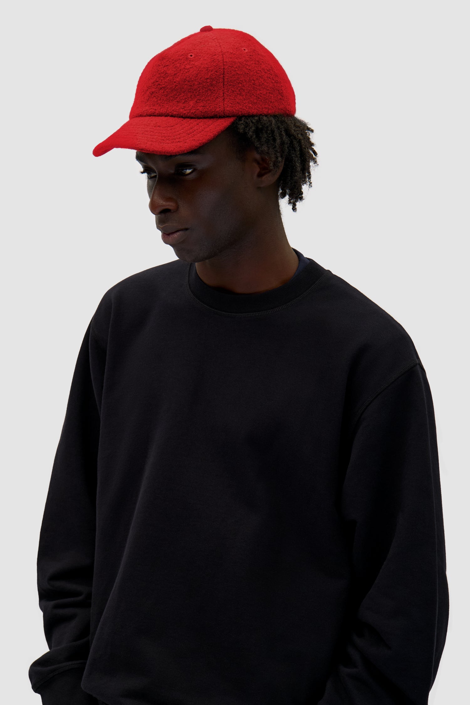 Wool Cap in Red worn by a model, half-body front view
