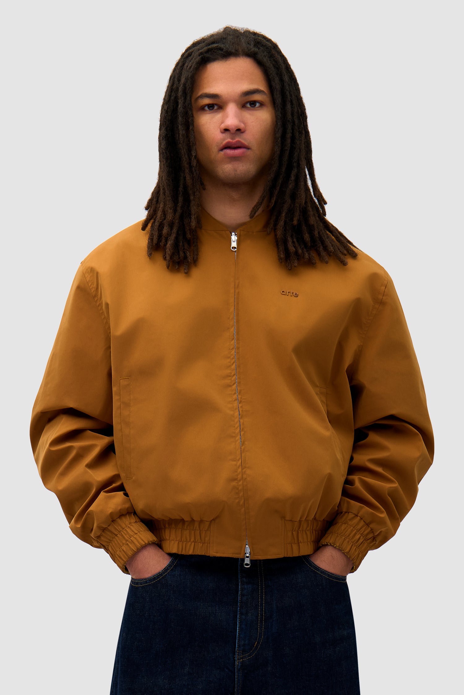 Reversible Nylon Jacket in Brown/Yellow worn by a model, half-body front view