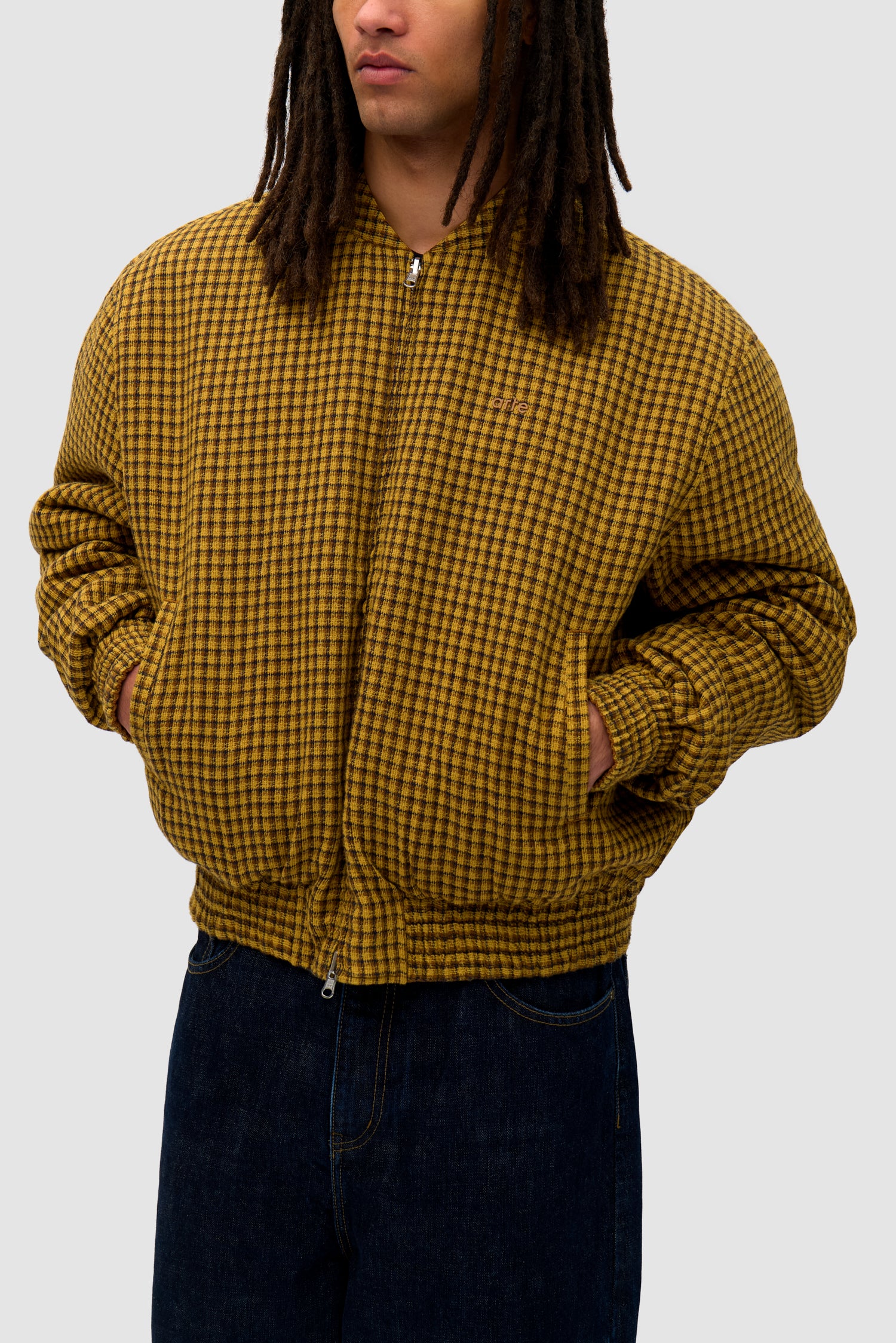 Reversible Nylon Jacket in Brown/Yellow worn reversed by a model, half-body front view