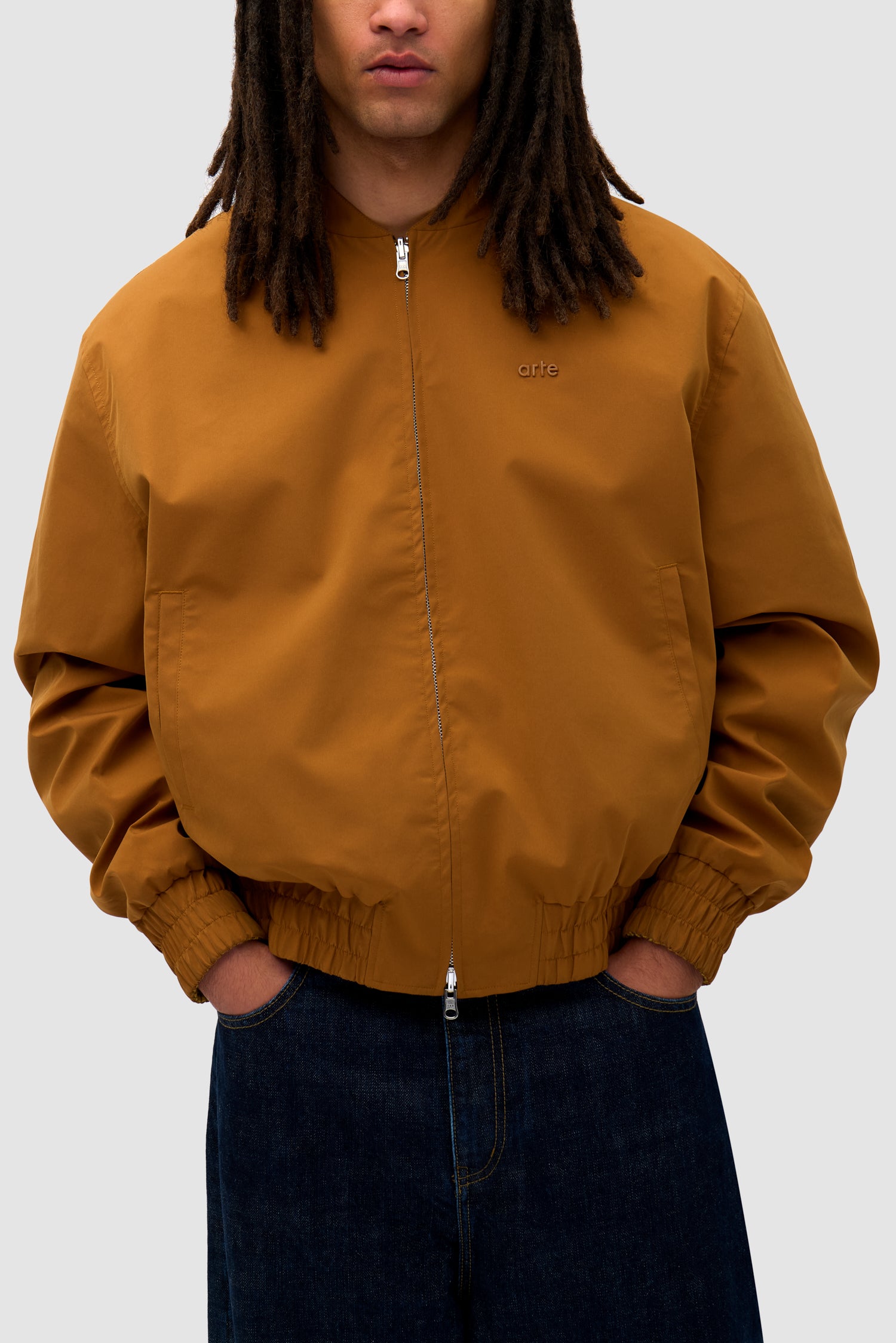 Detail view of Reversible Nylon Jacket in Brown/Yellow
