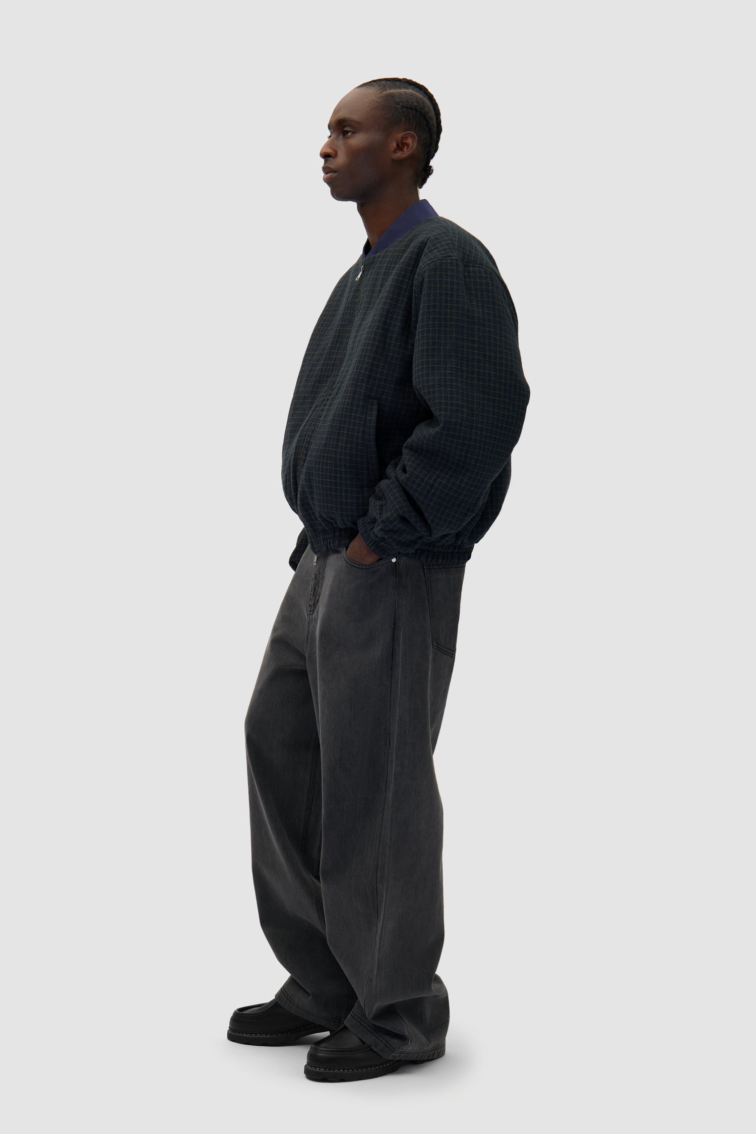 Reversible Nylon Jacket in Navy/Green worn by a model, full-body side view