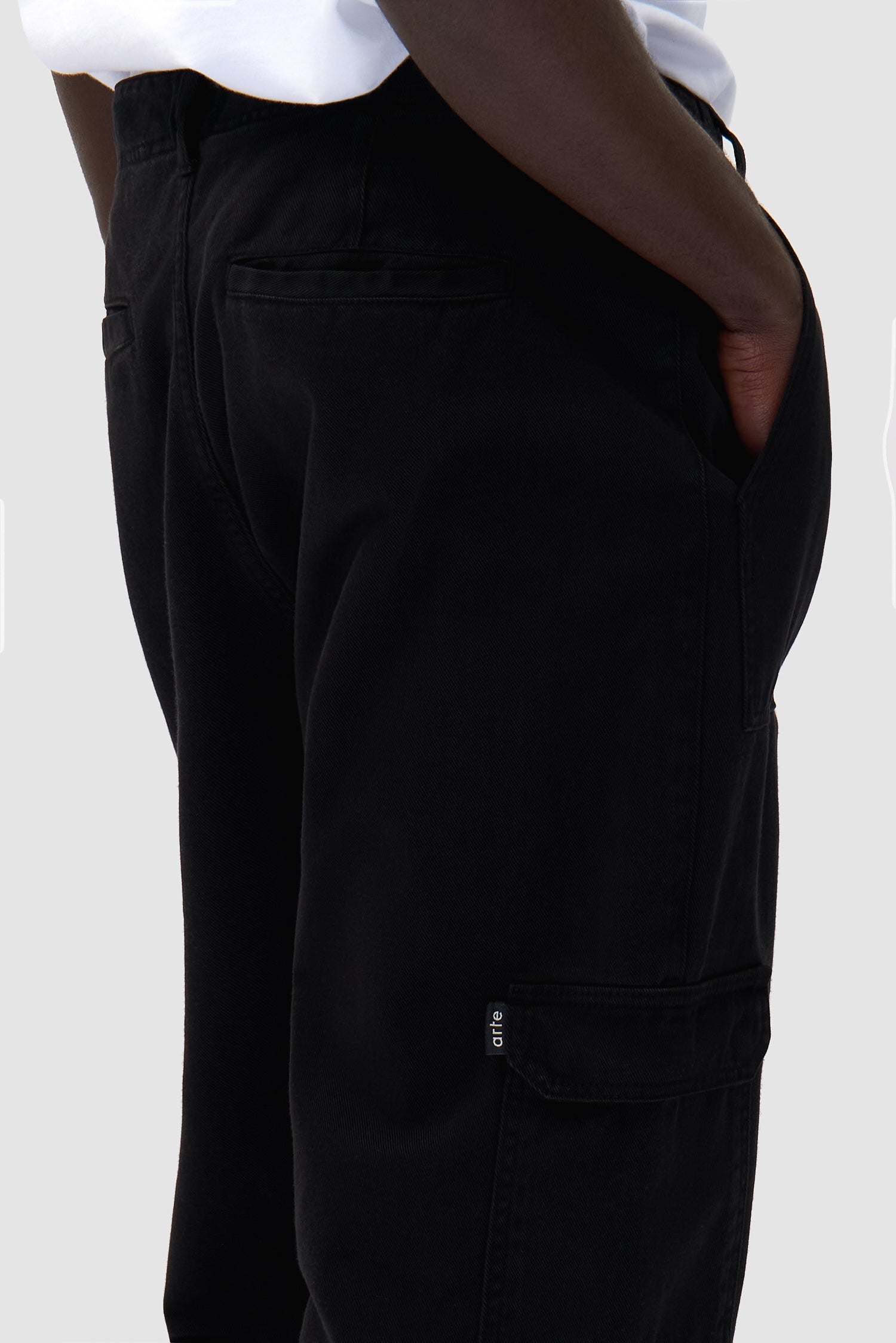 Cargo Pants in Black worn by a model, full-body front view