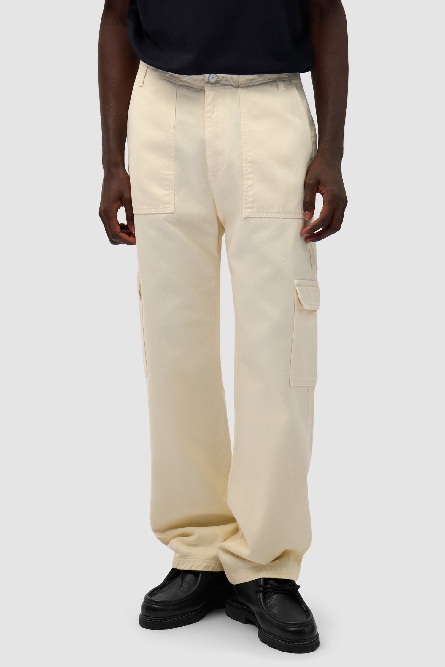 Cargo Pants in Cream worn by a model, half-body front view