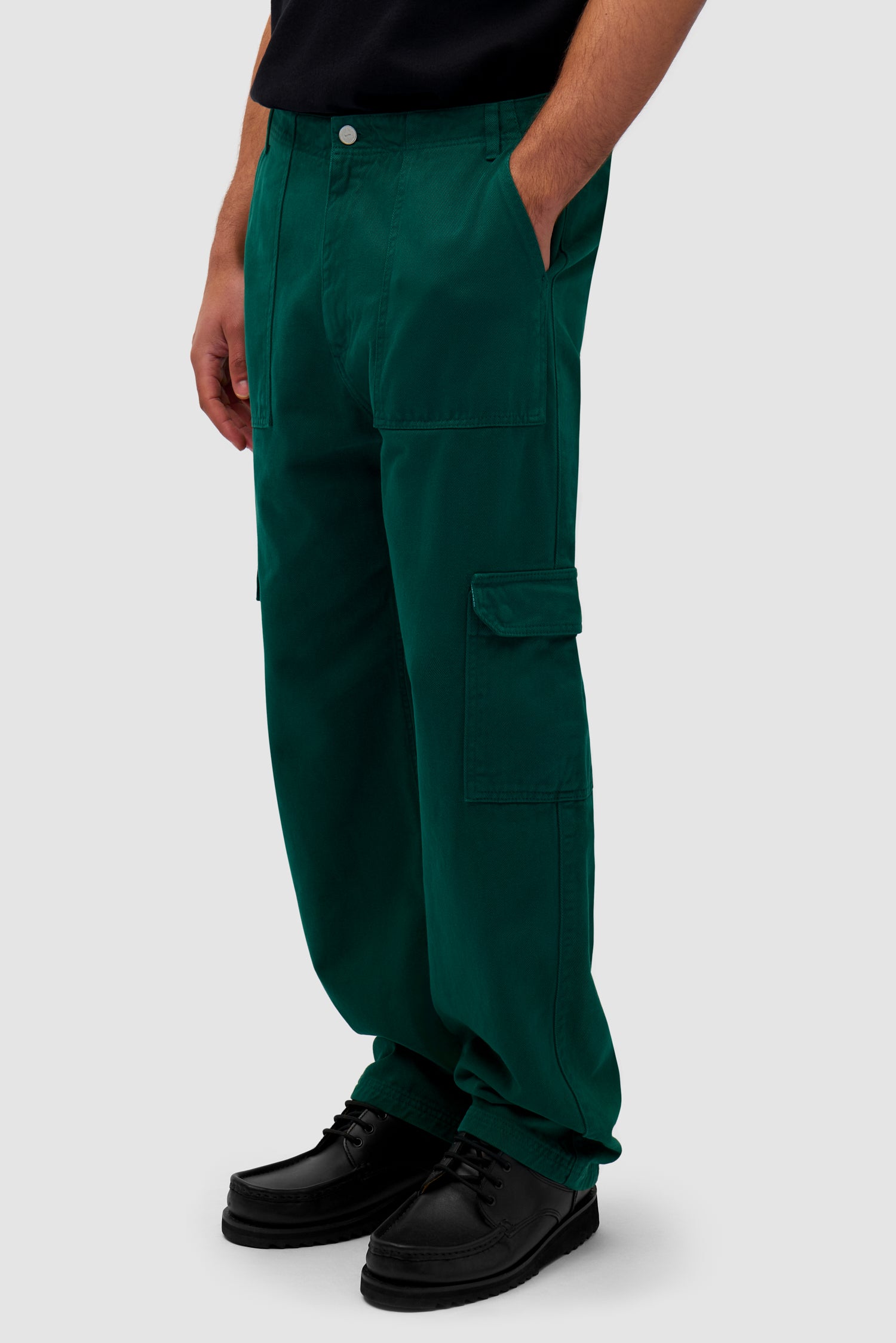Cargo Pants in Green worn by a model, half-body side view