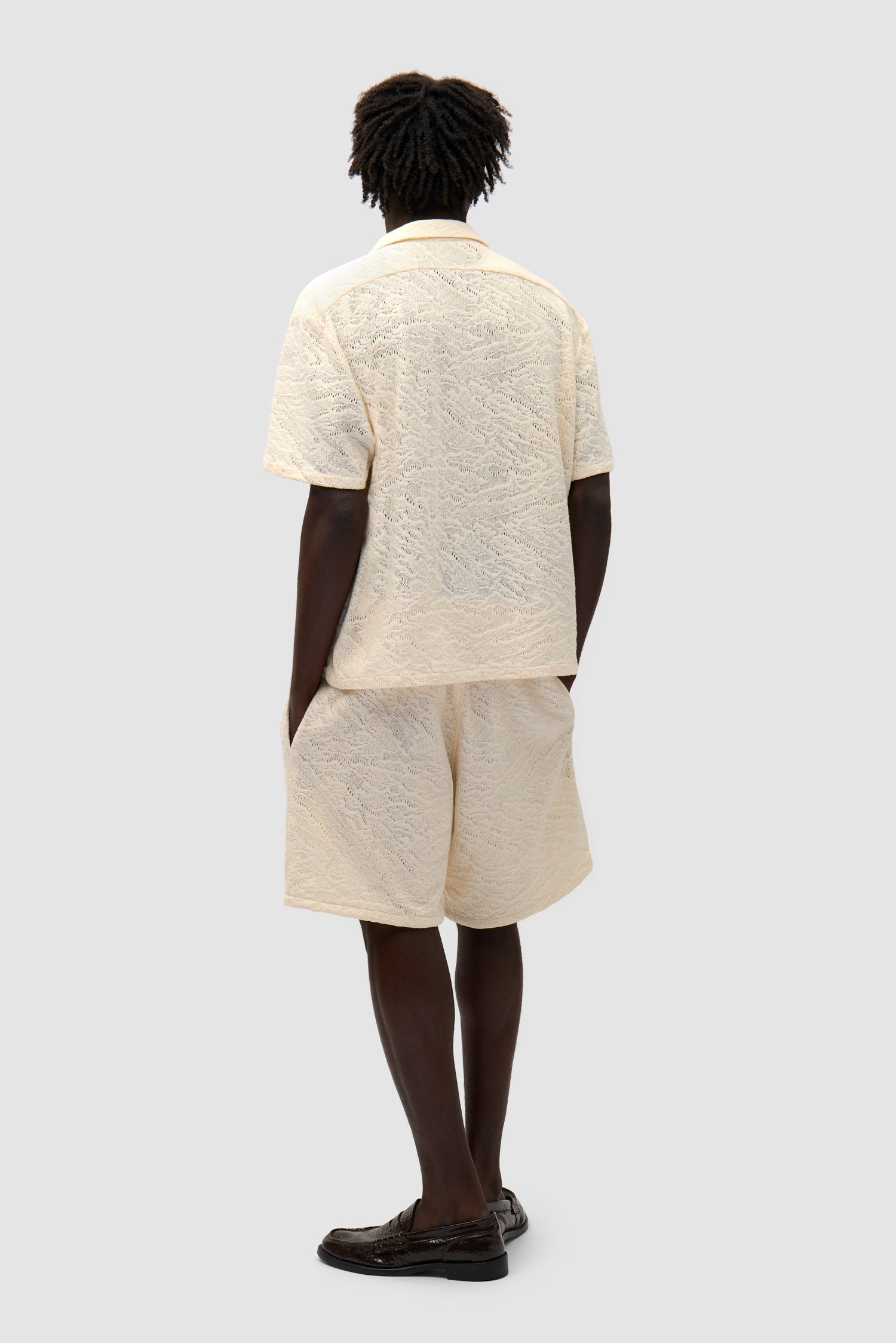 Crochet Shirt in Cream worn by a model, full-body back view