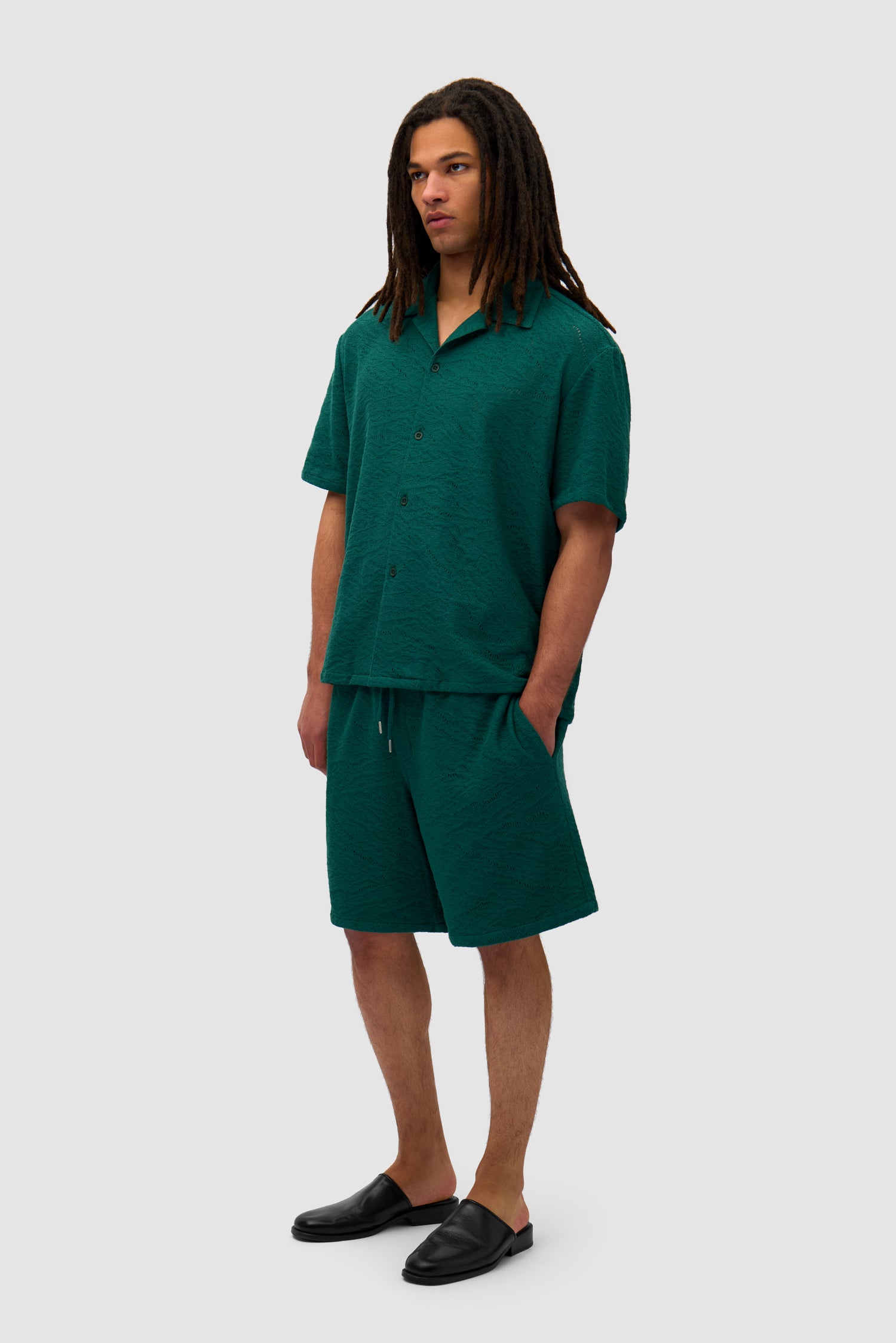 Crochet Shirt in Green worn by a model, full-body side view