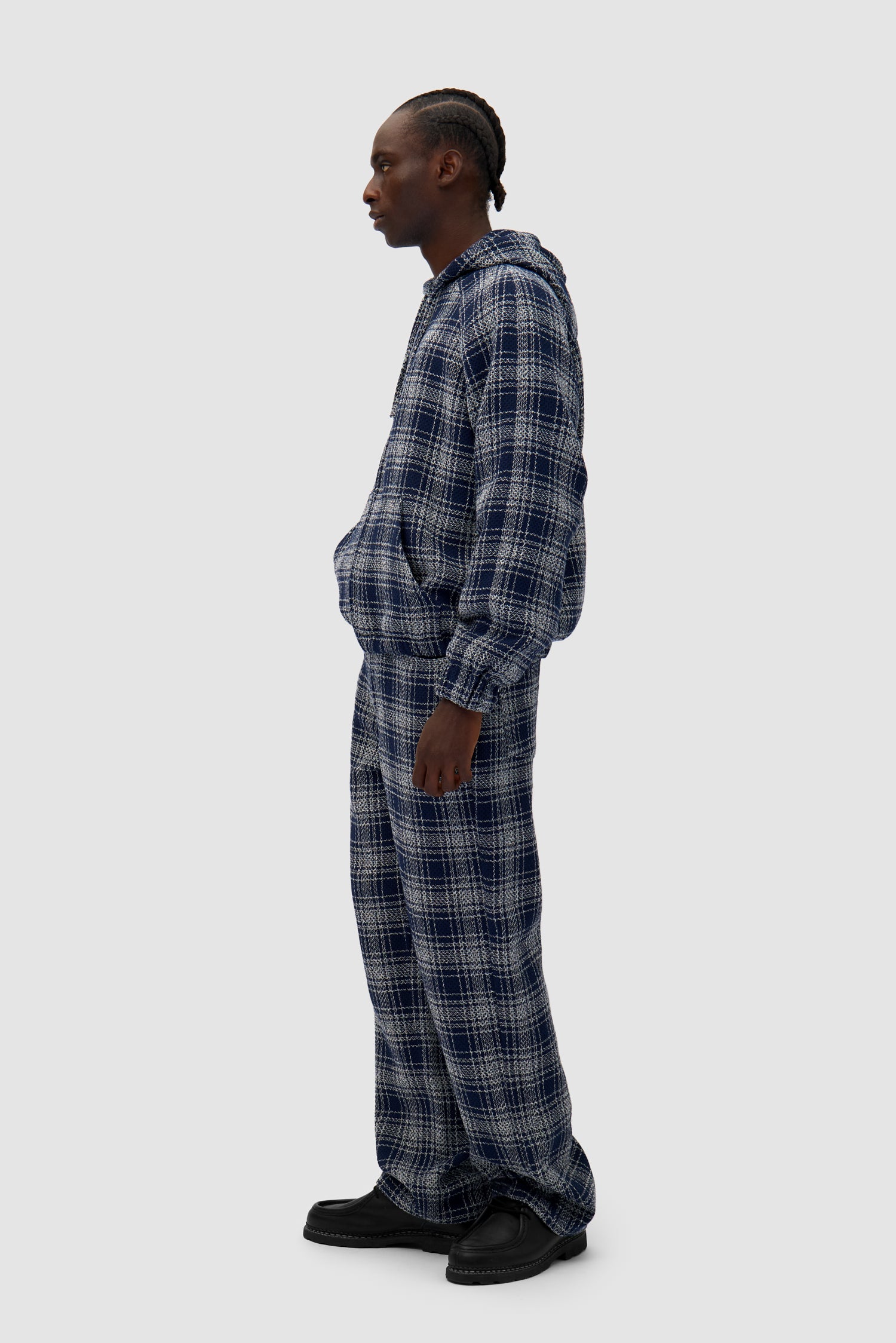Square Fabric Pants in Plaid worn by a model, full-body side view