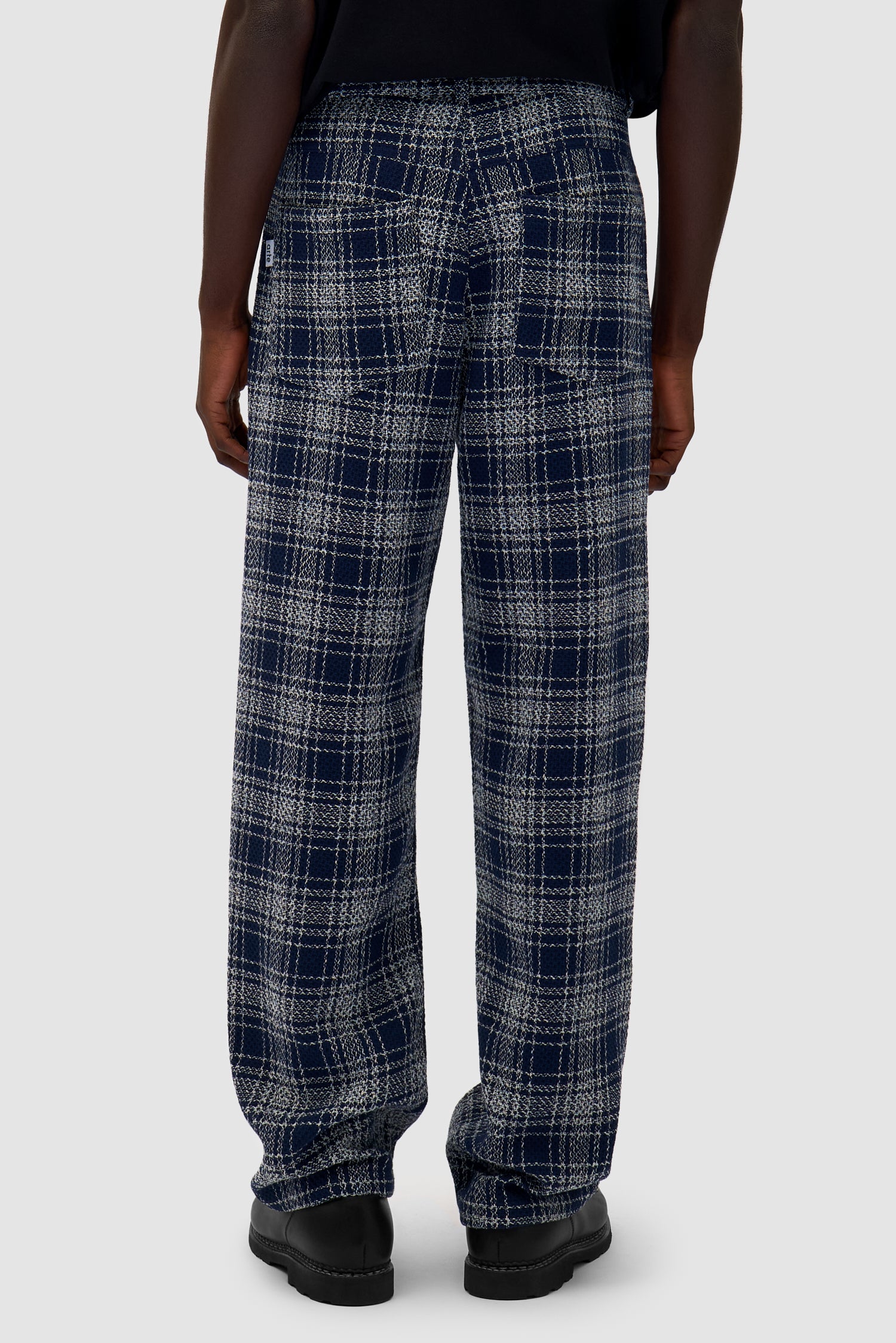 Square Fabric Pants in Plaid worn by a model, half-body back view