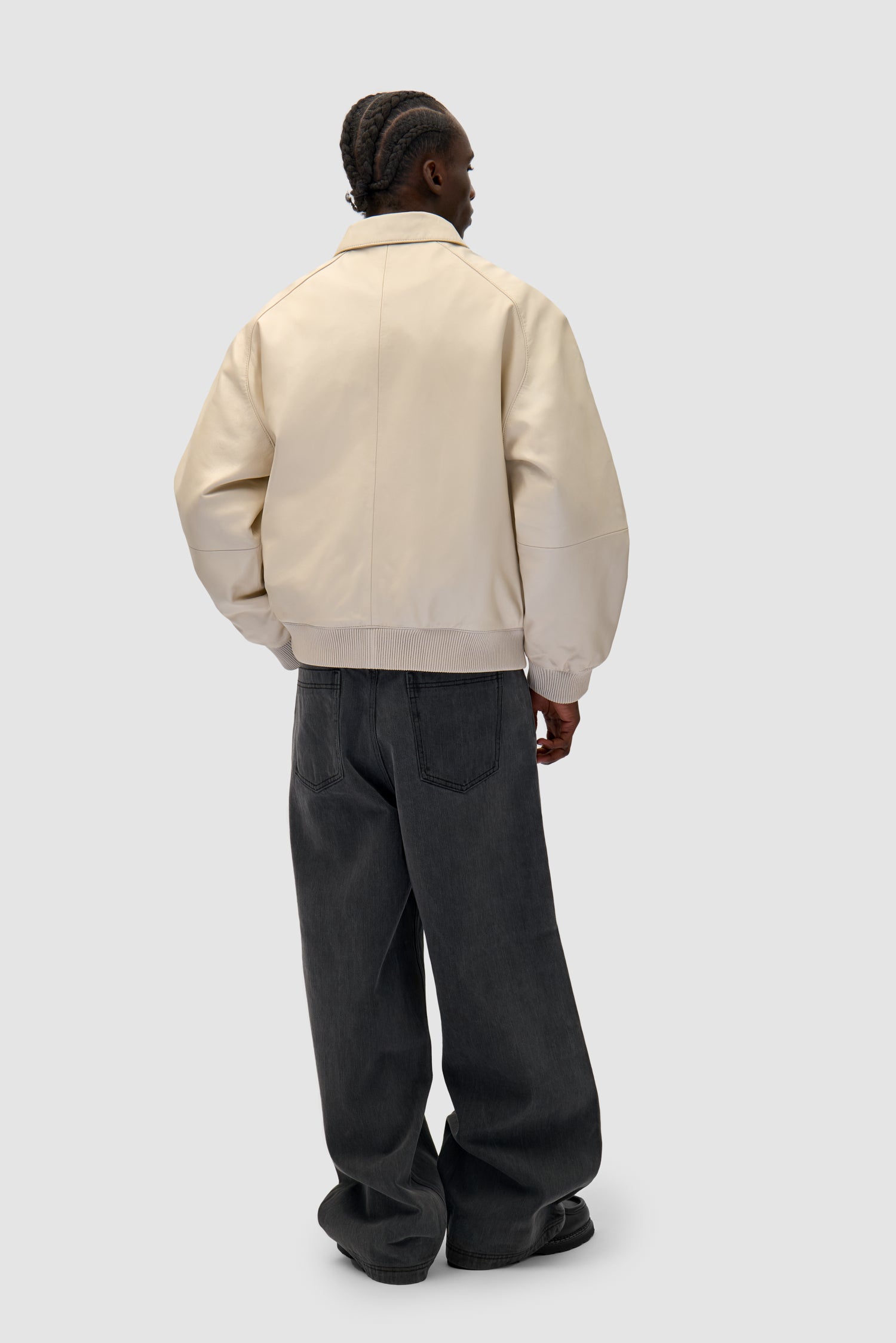 Square Leather Jacket in Cream worn by a model, full-body back view