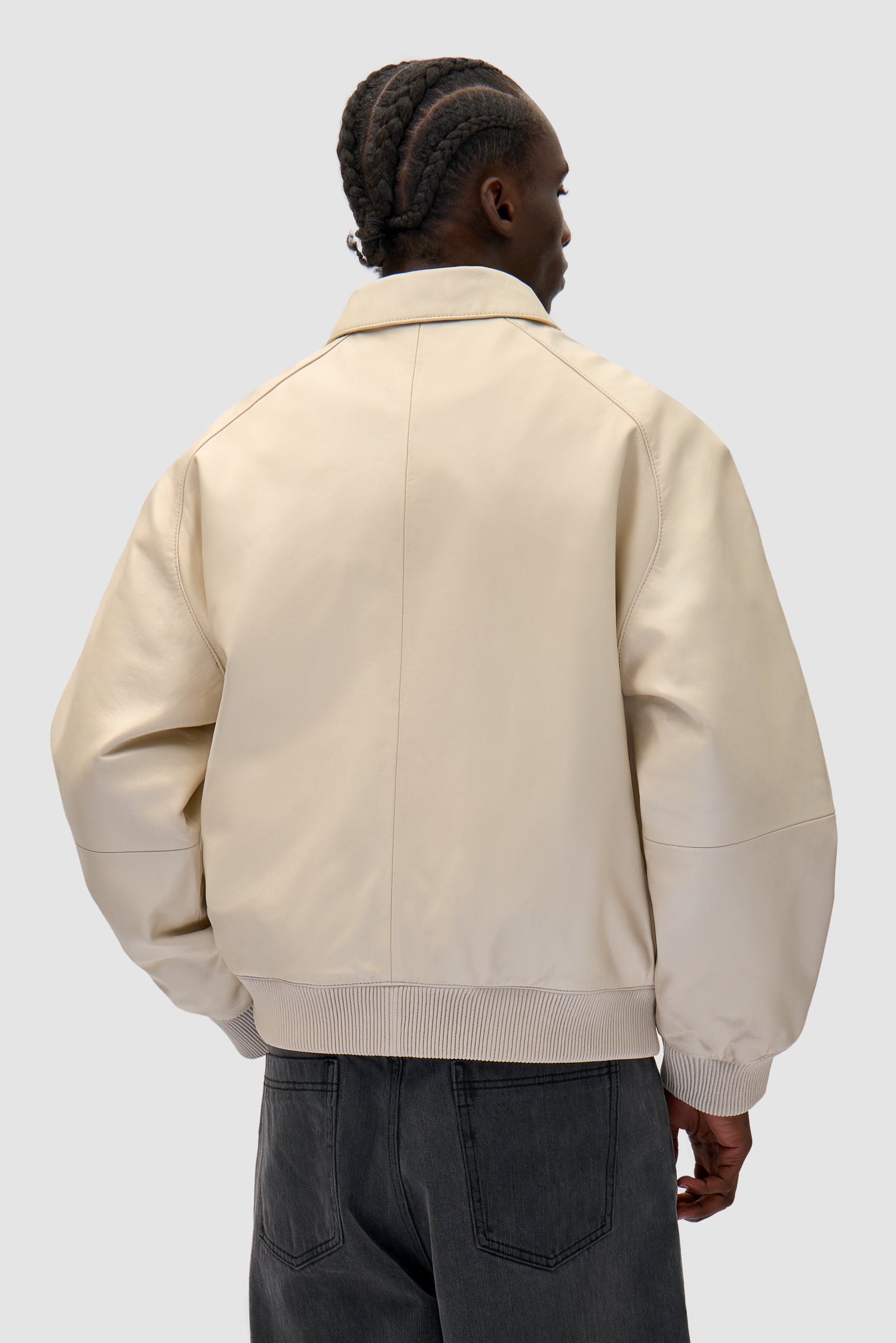 Square Leather Jacket in Cream worn by a model, half-body back view