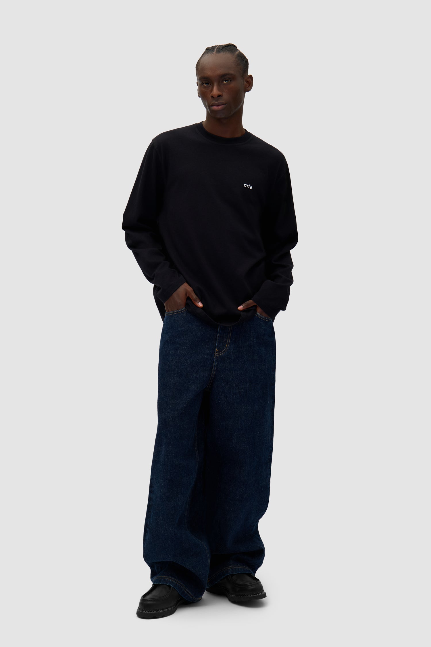 Color Print Longsleeve in Black worn by a model, full-body front view