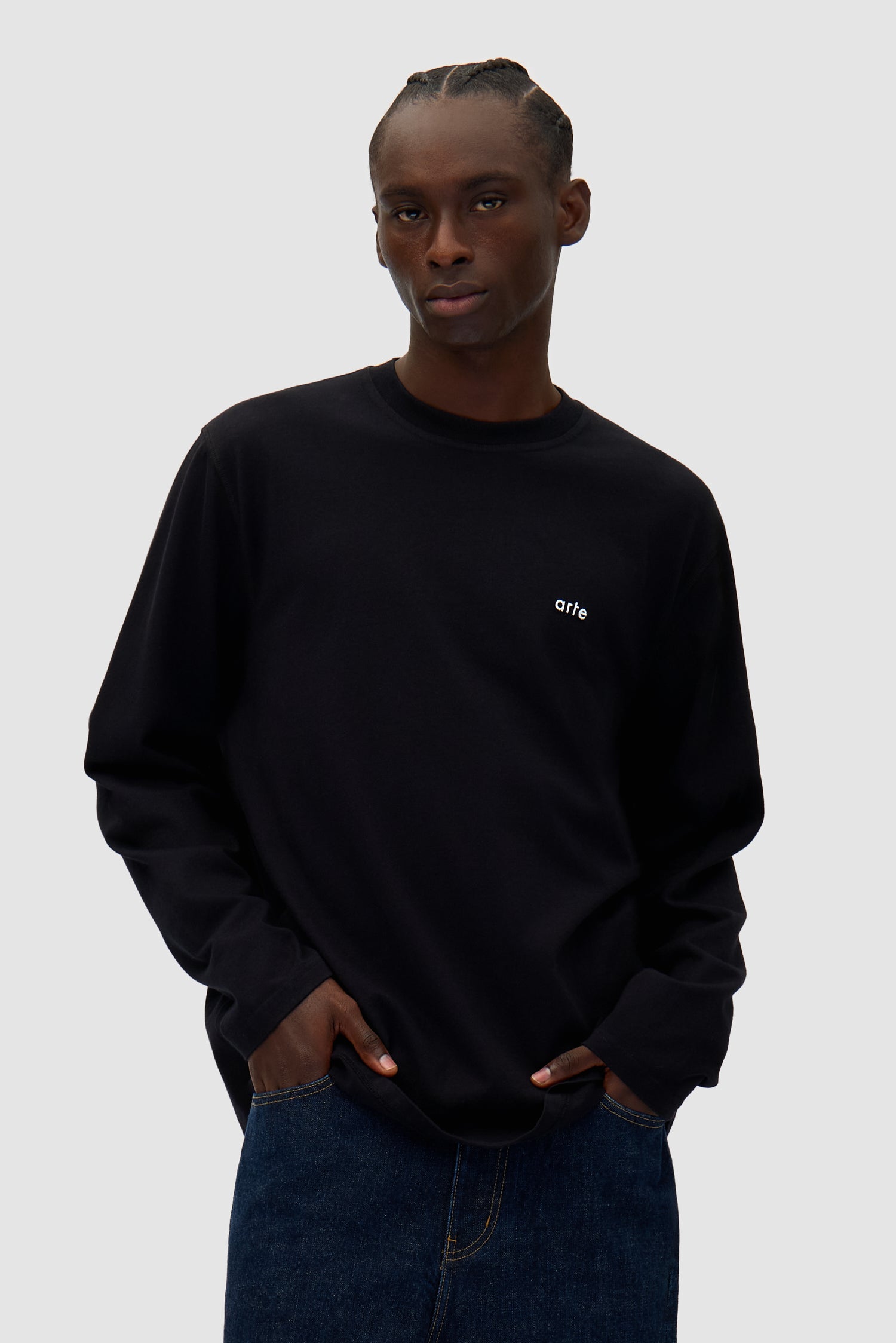 Color Print Longsleeve in Black worn by a model, half-body front view