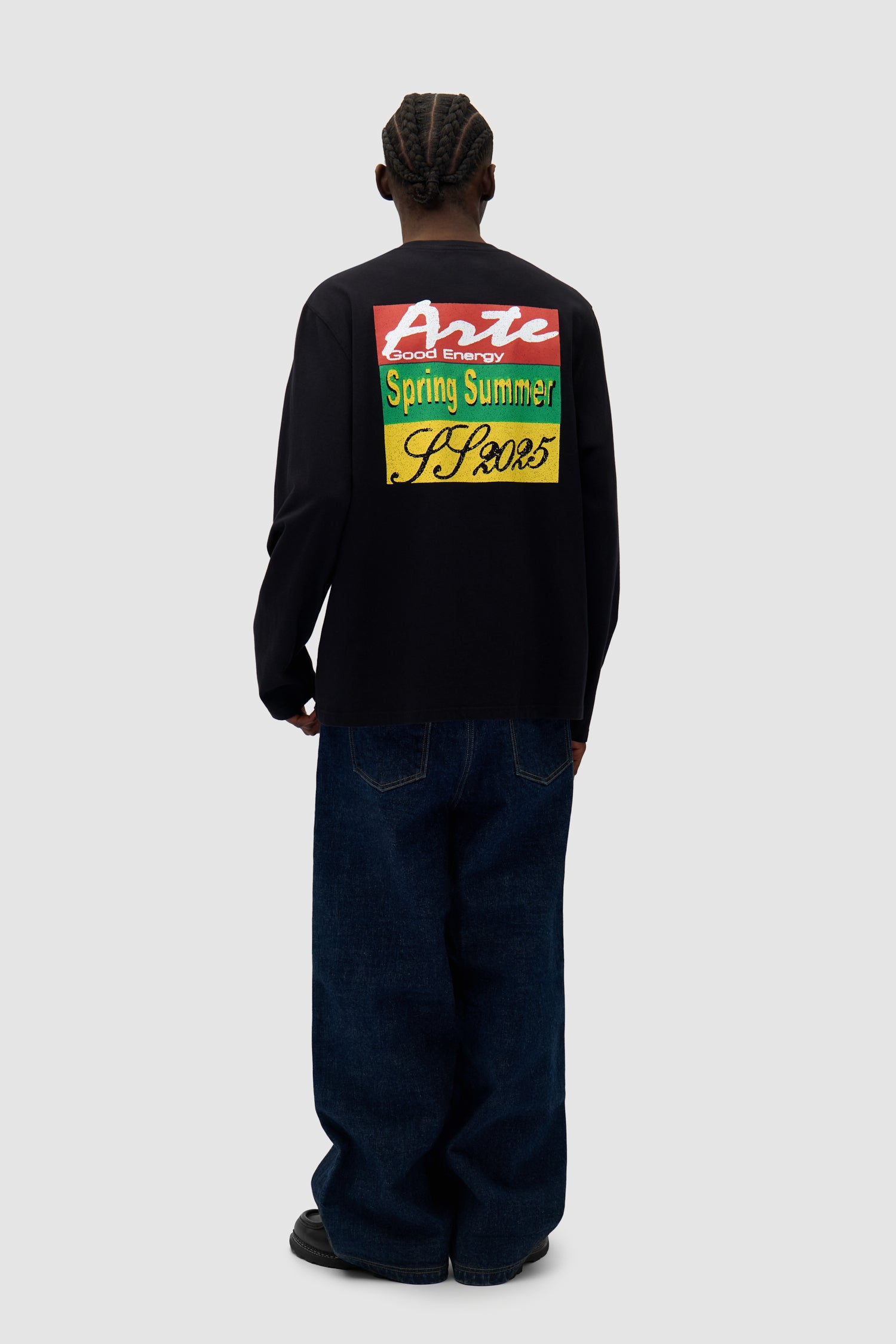 Color Print Longsleeve in Black worn by a model, full-body back view